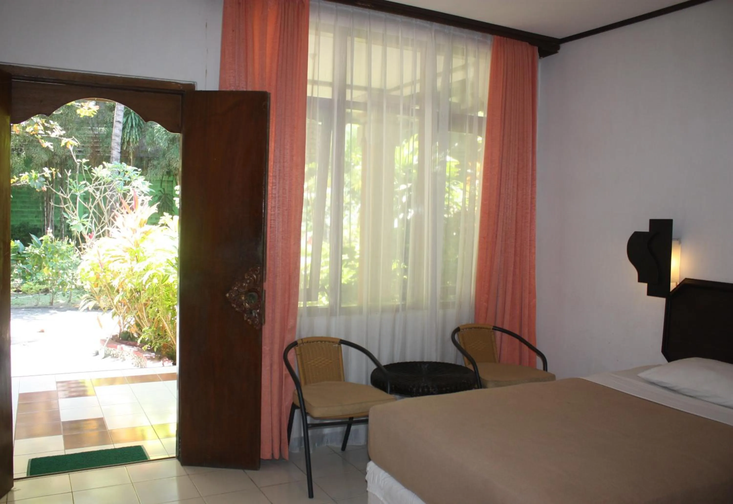 Shower, Bed in Puri Naga Beachfront Cottages