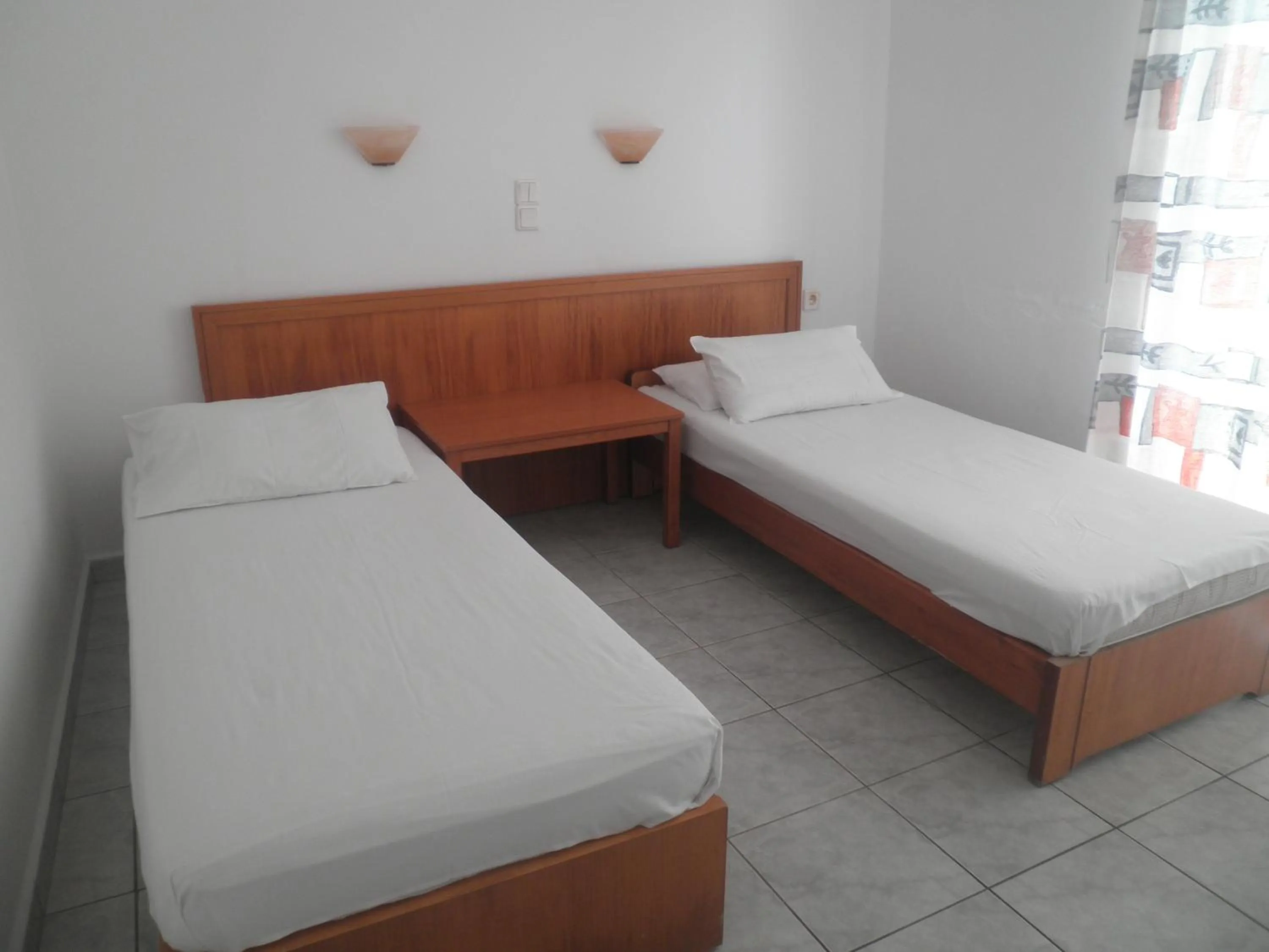 Bed in Haridimos Apartments