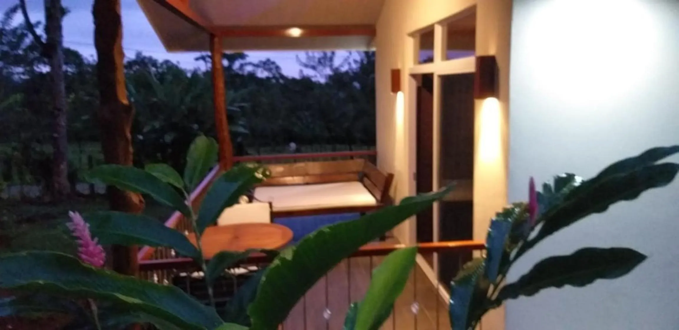 Balcony/Terrace, Bed in Tropical Suites & Villas