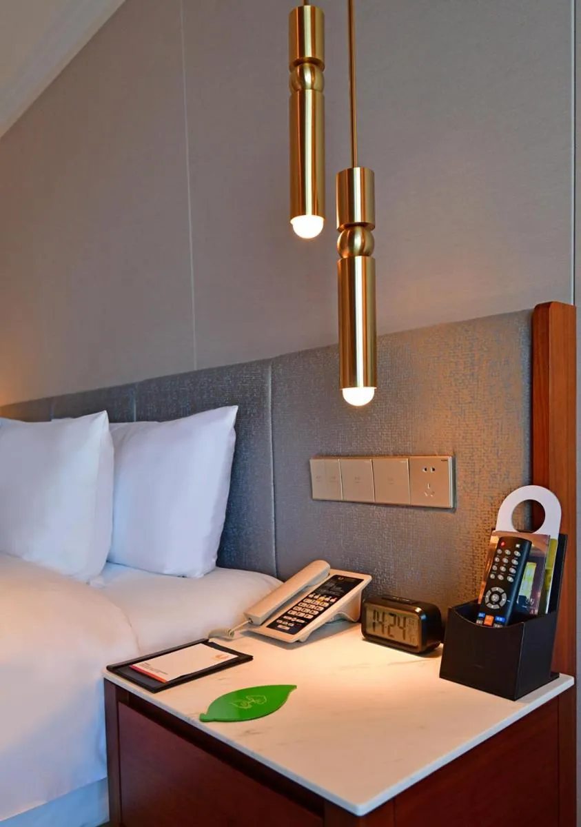 Bed in V-Continent Beijing Parkview Wuzhou Hotel