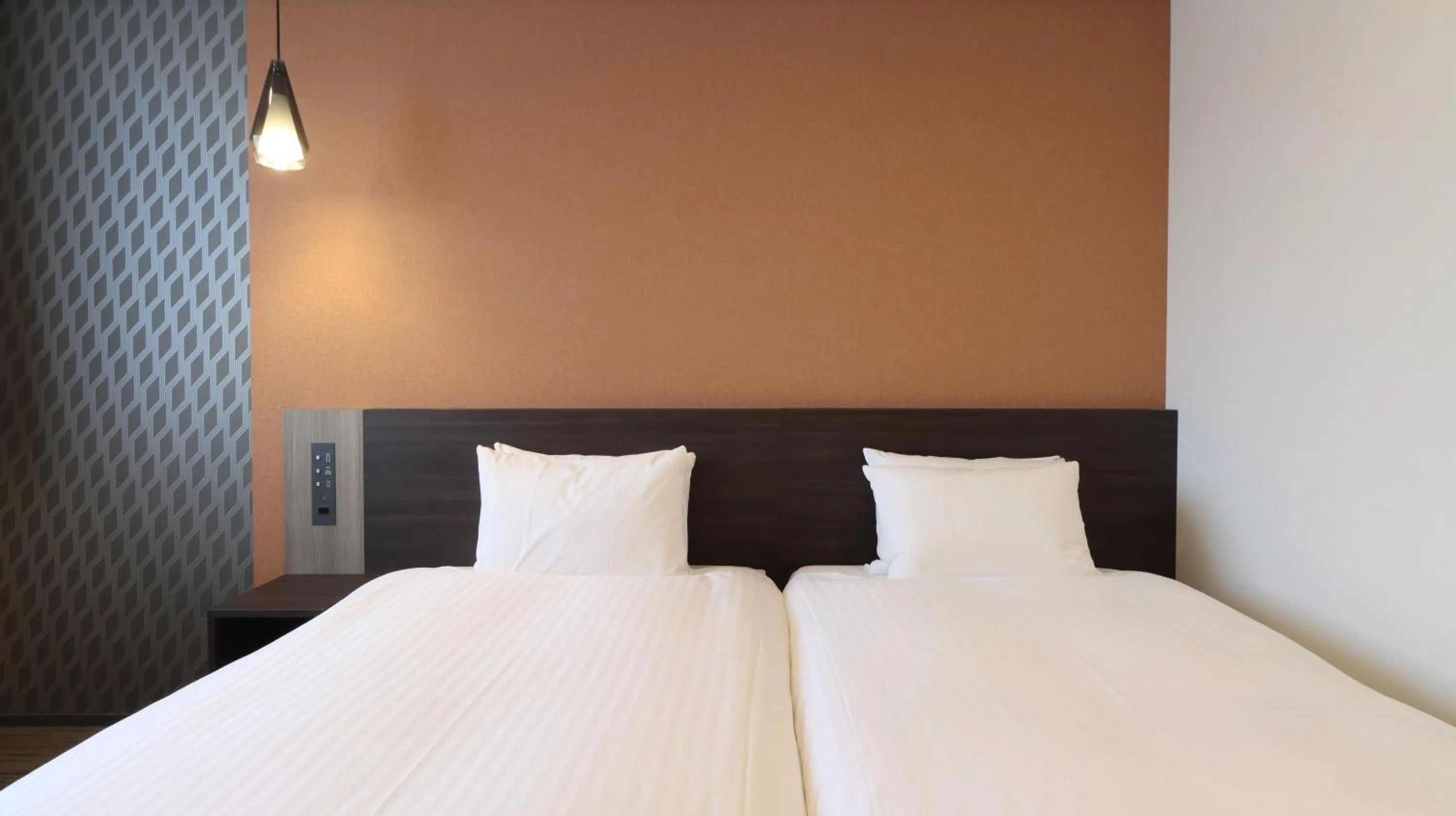 Bed in Wander Kyoto Nanajo