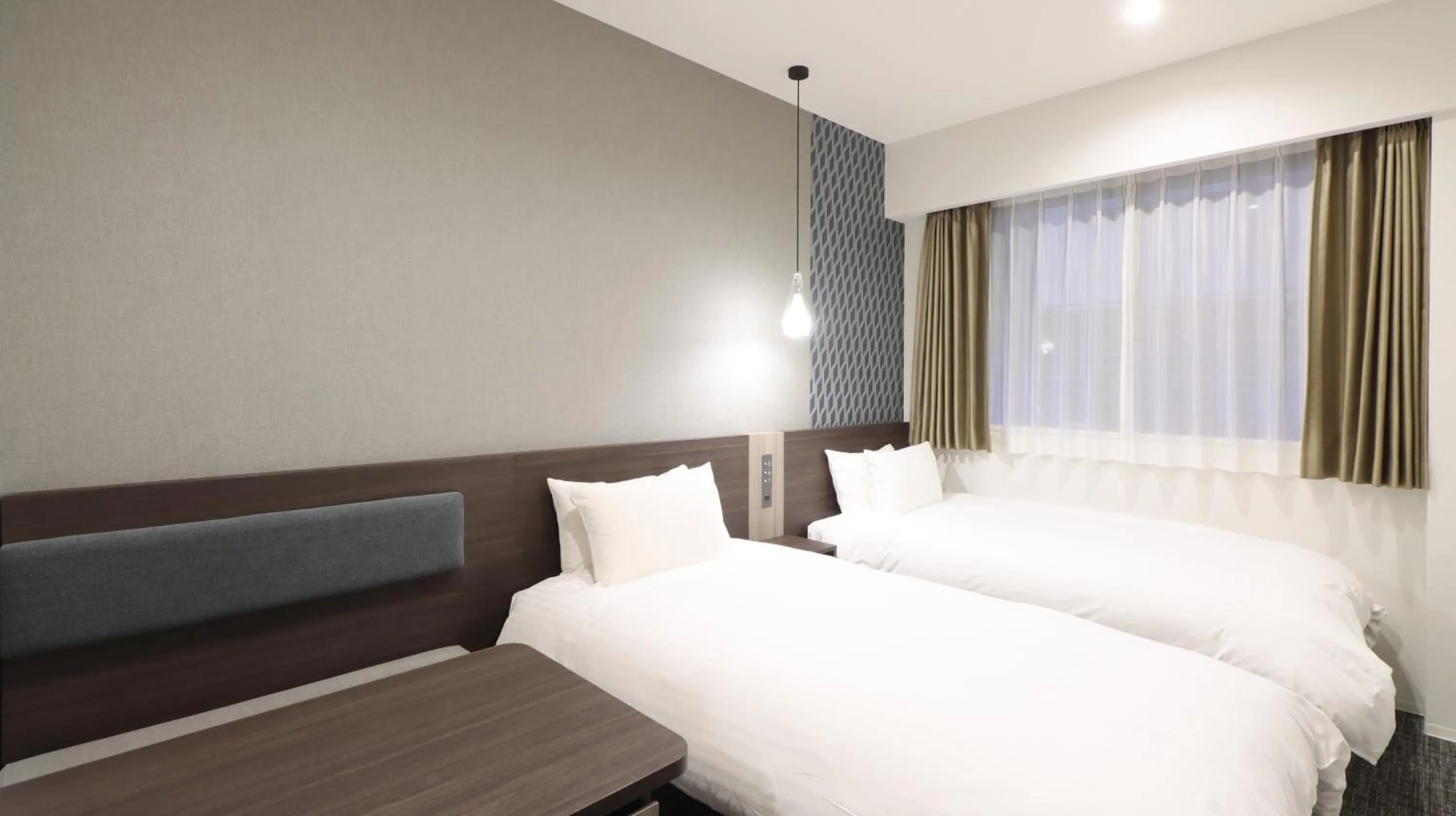 Bed in Wander Kyoto Nanajo