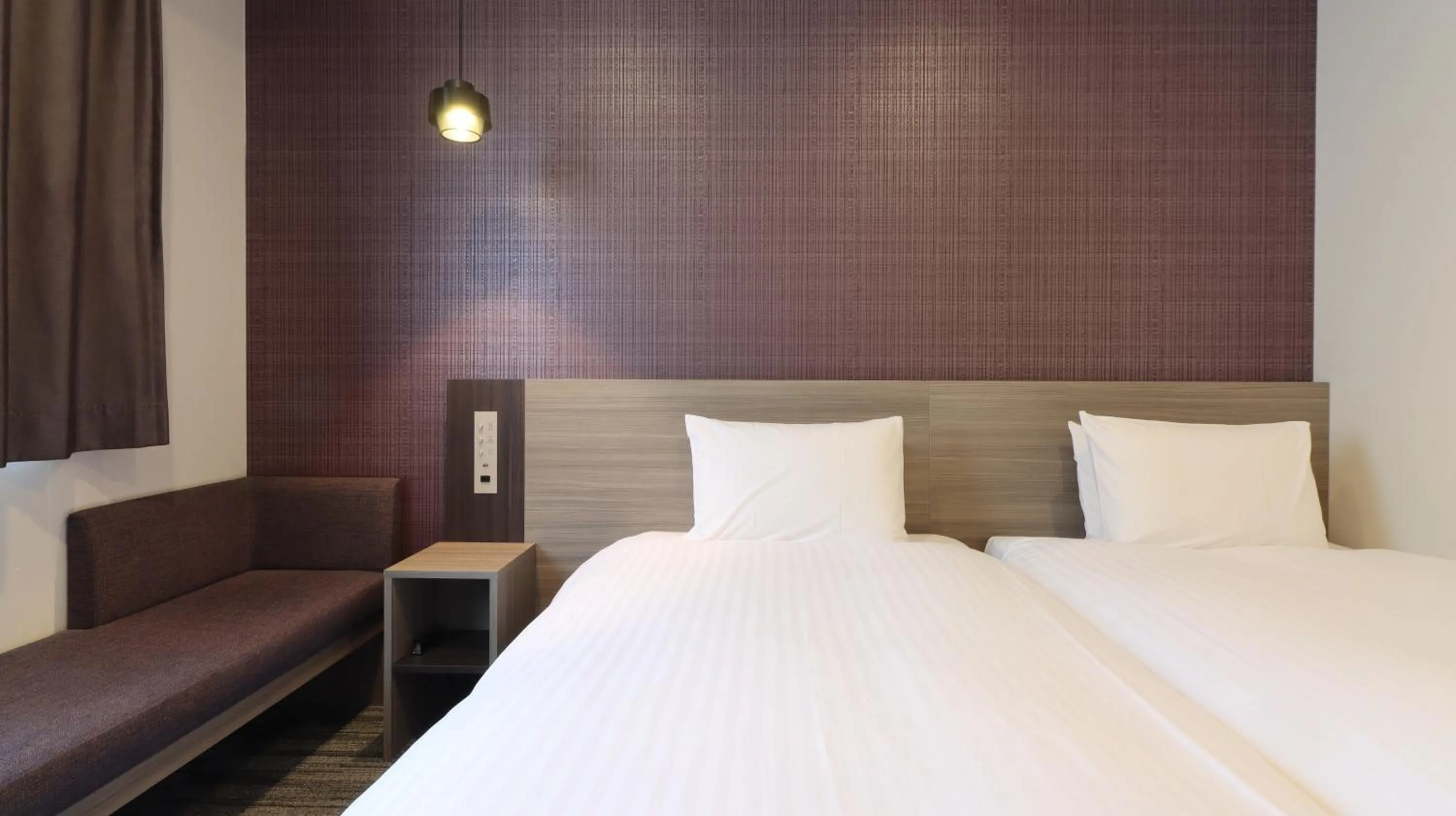 Bed in Wander Kyoto Nanajo