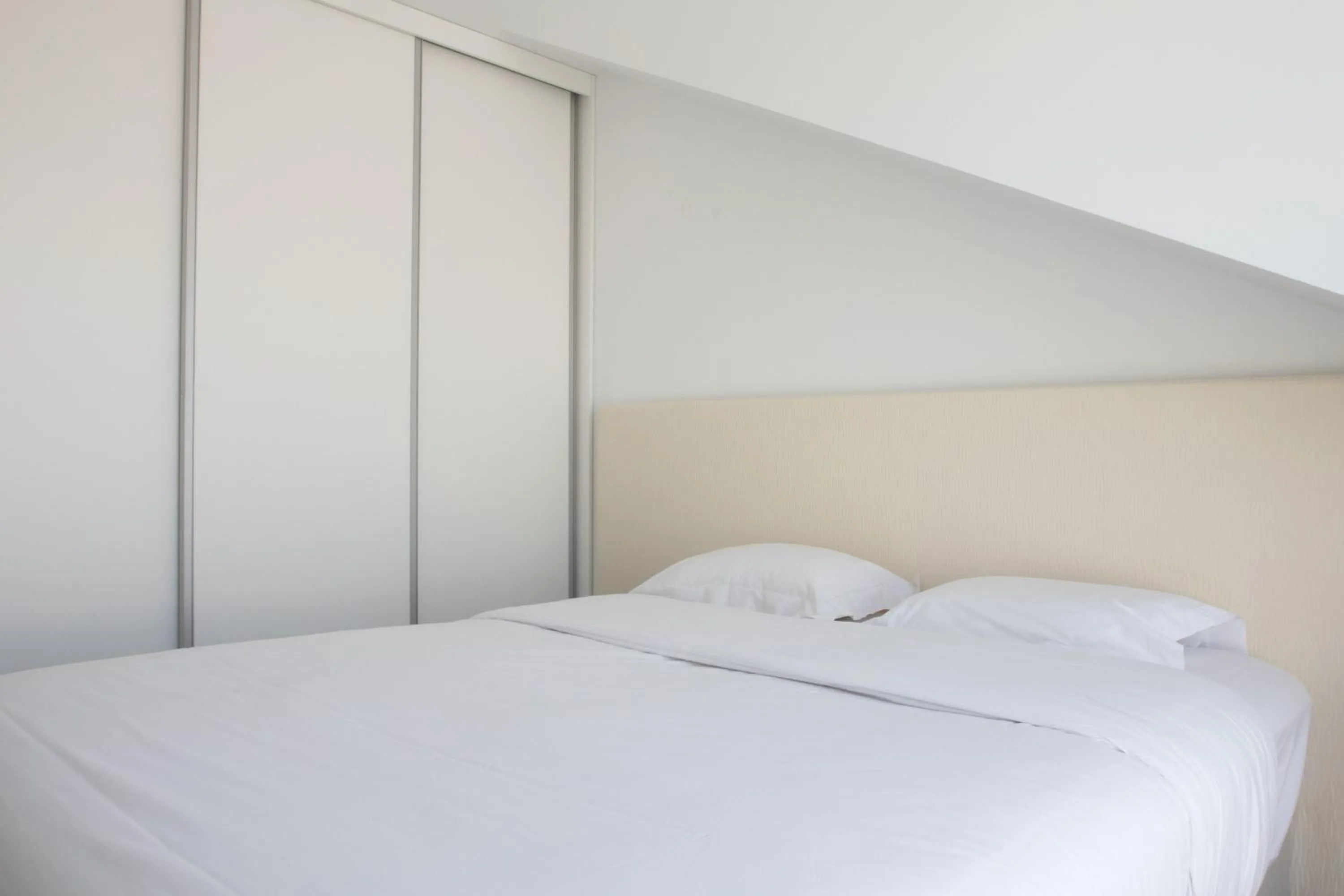 Bed in Oscar Concept Apartments