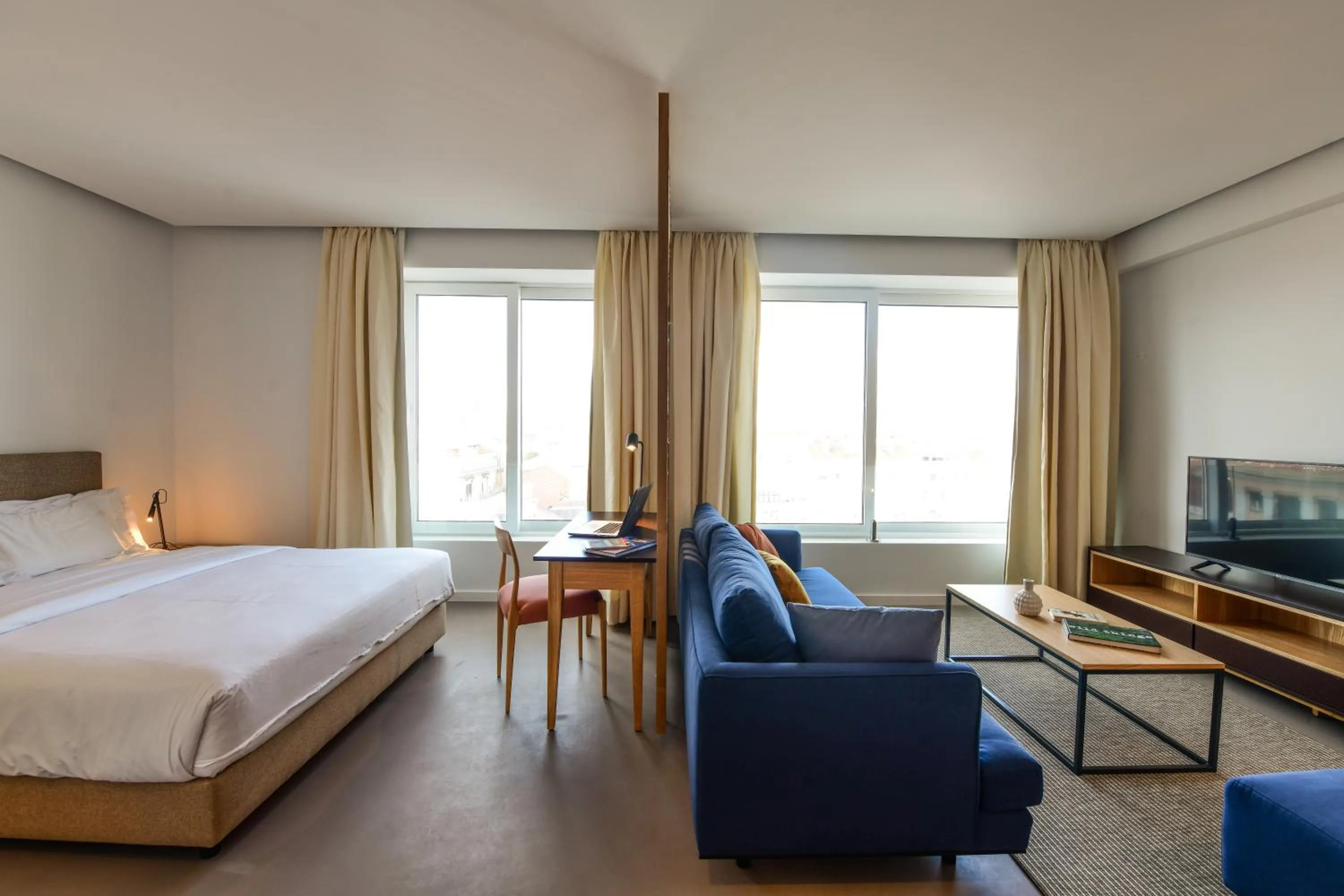 Bed in Oscar Concept Apartments