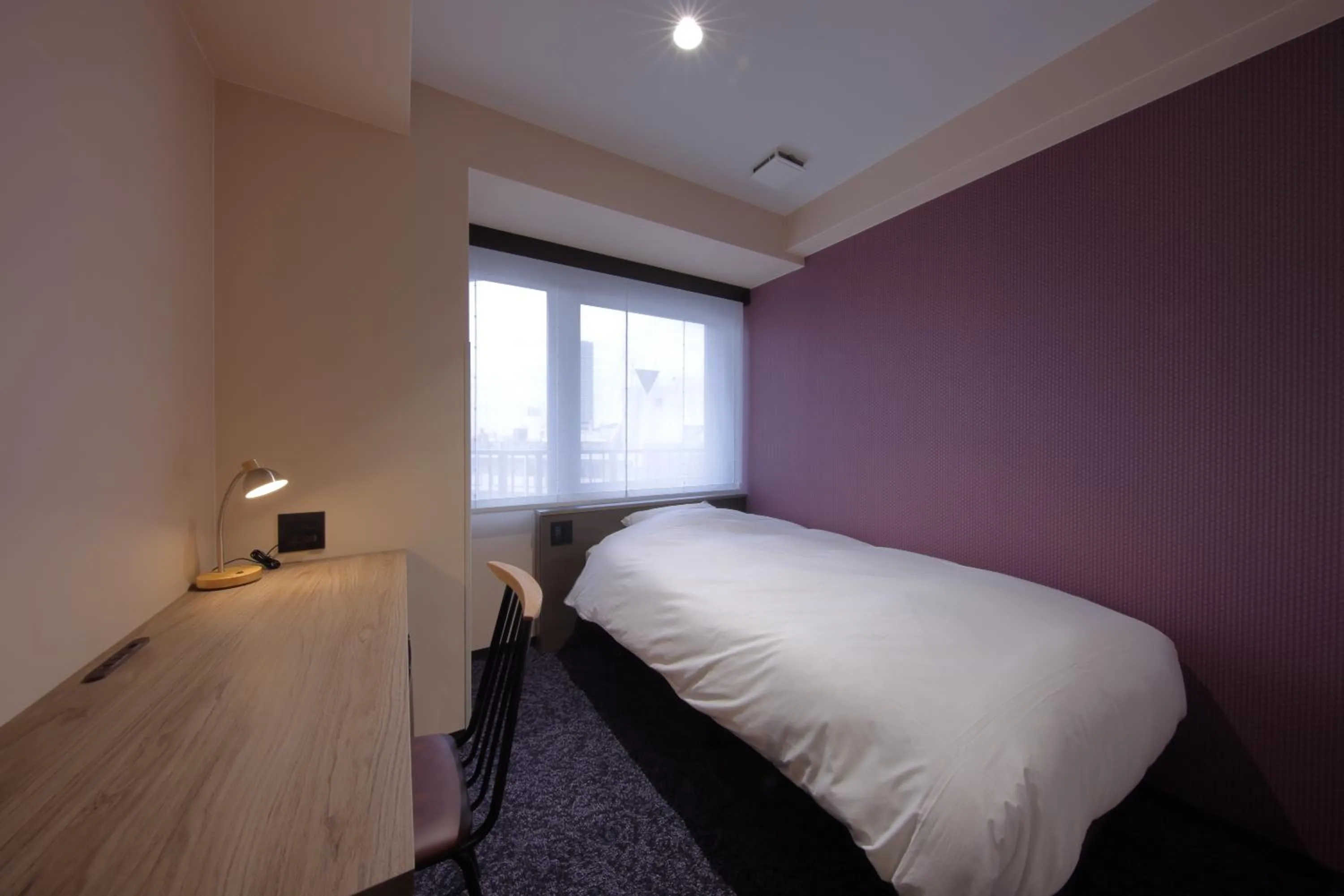 Photo of the whole room, Bed in Hotel SUI Kobe Sannomiya by ABEST