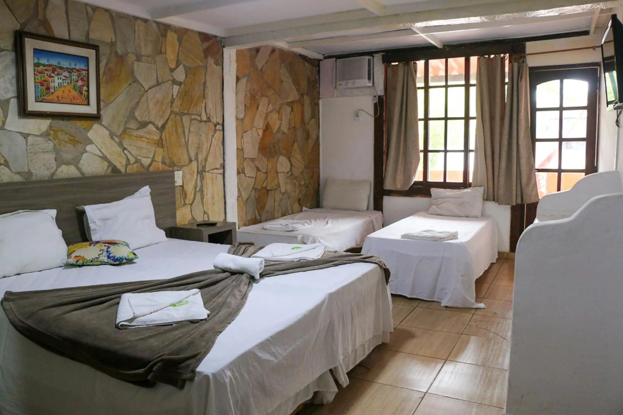 Photo of the whole room, Bed in Tarumã Búzios Hotel