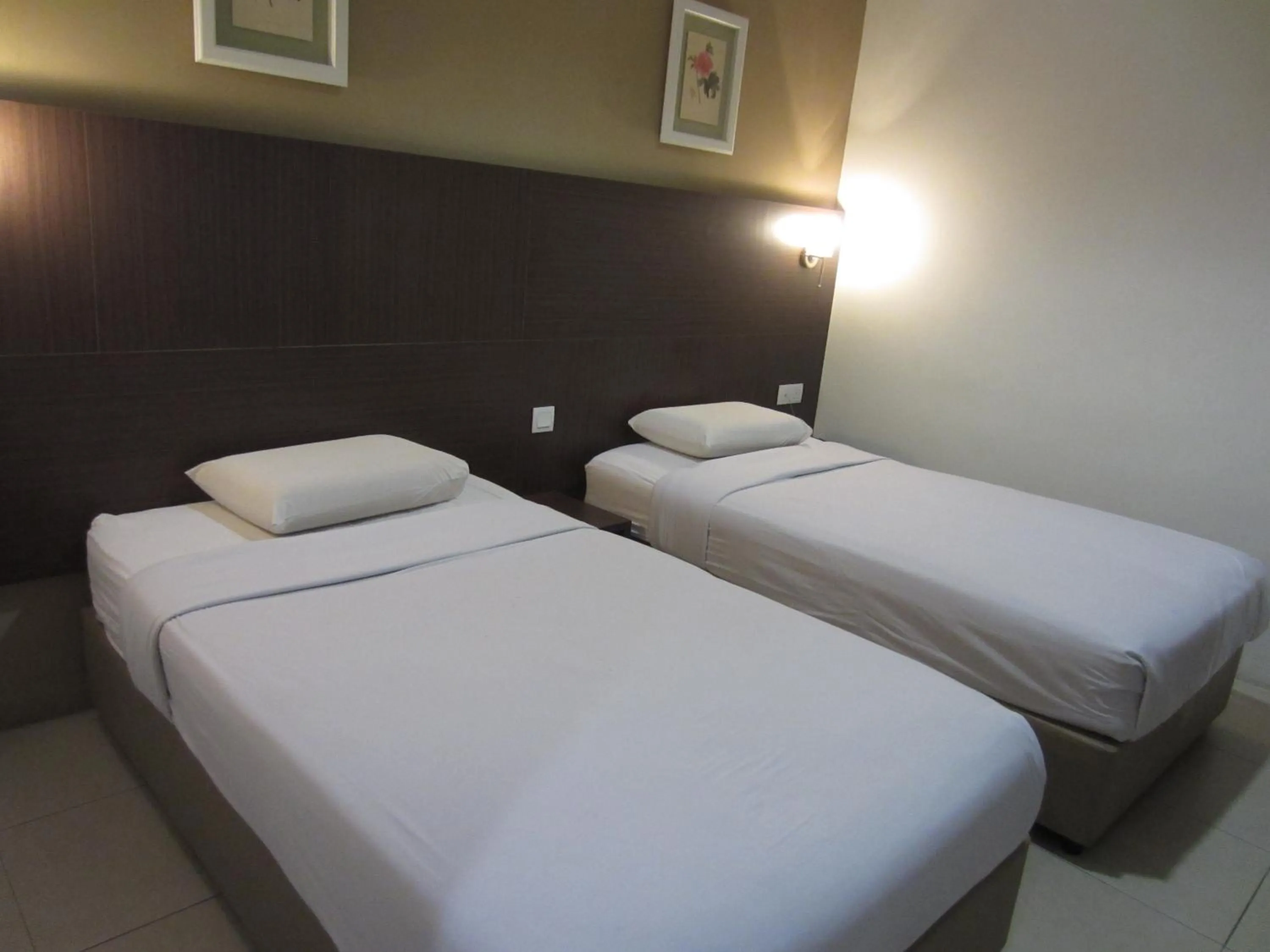 Bed in Radiant Hotel