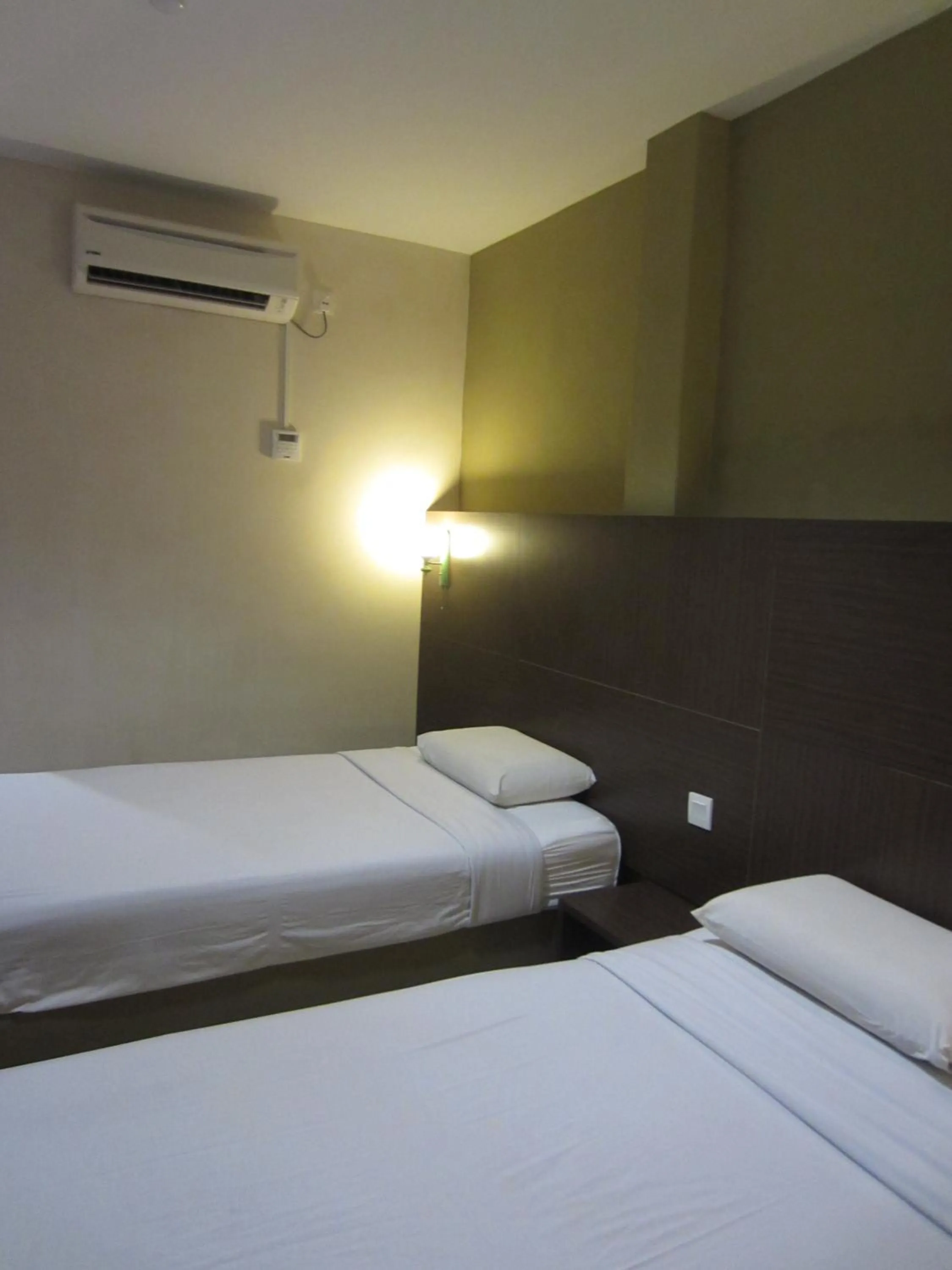 Bed in Radiant Hotel