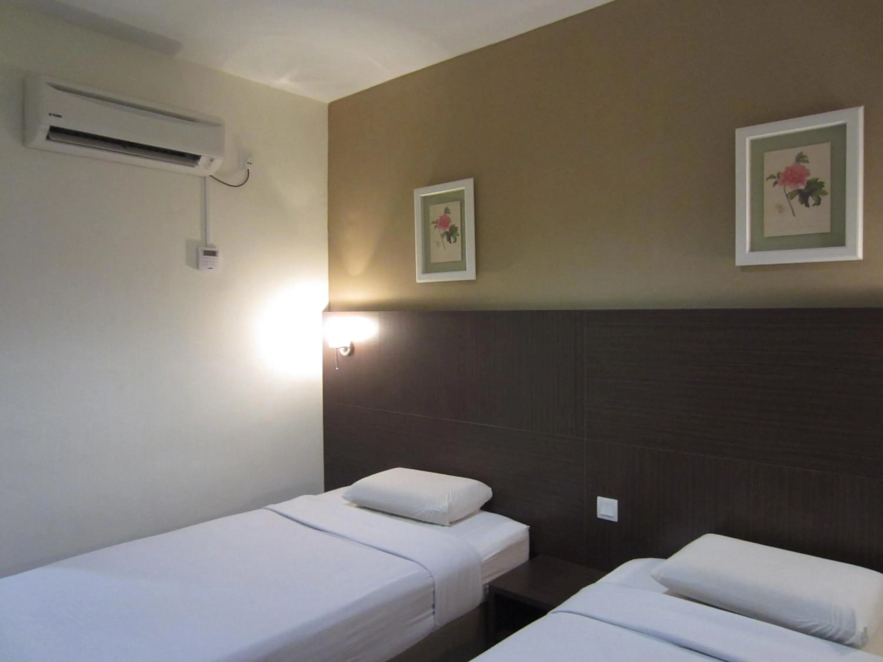 Bed in Radiant Hotel