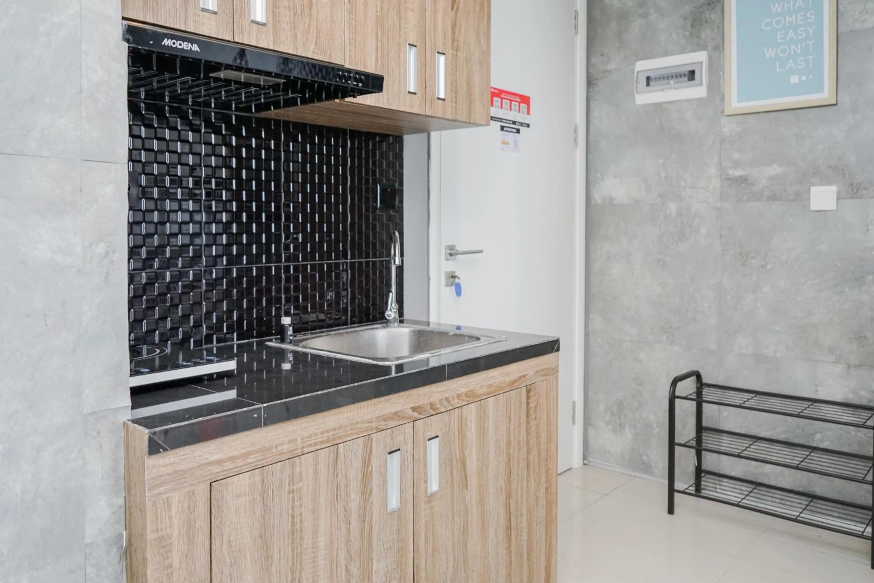 Kitchen or kitchenette in Cozy 2BR Apartment at Tuscany Residences With Garden View By Travelio