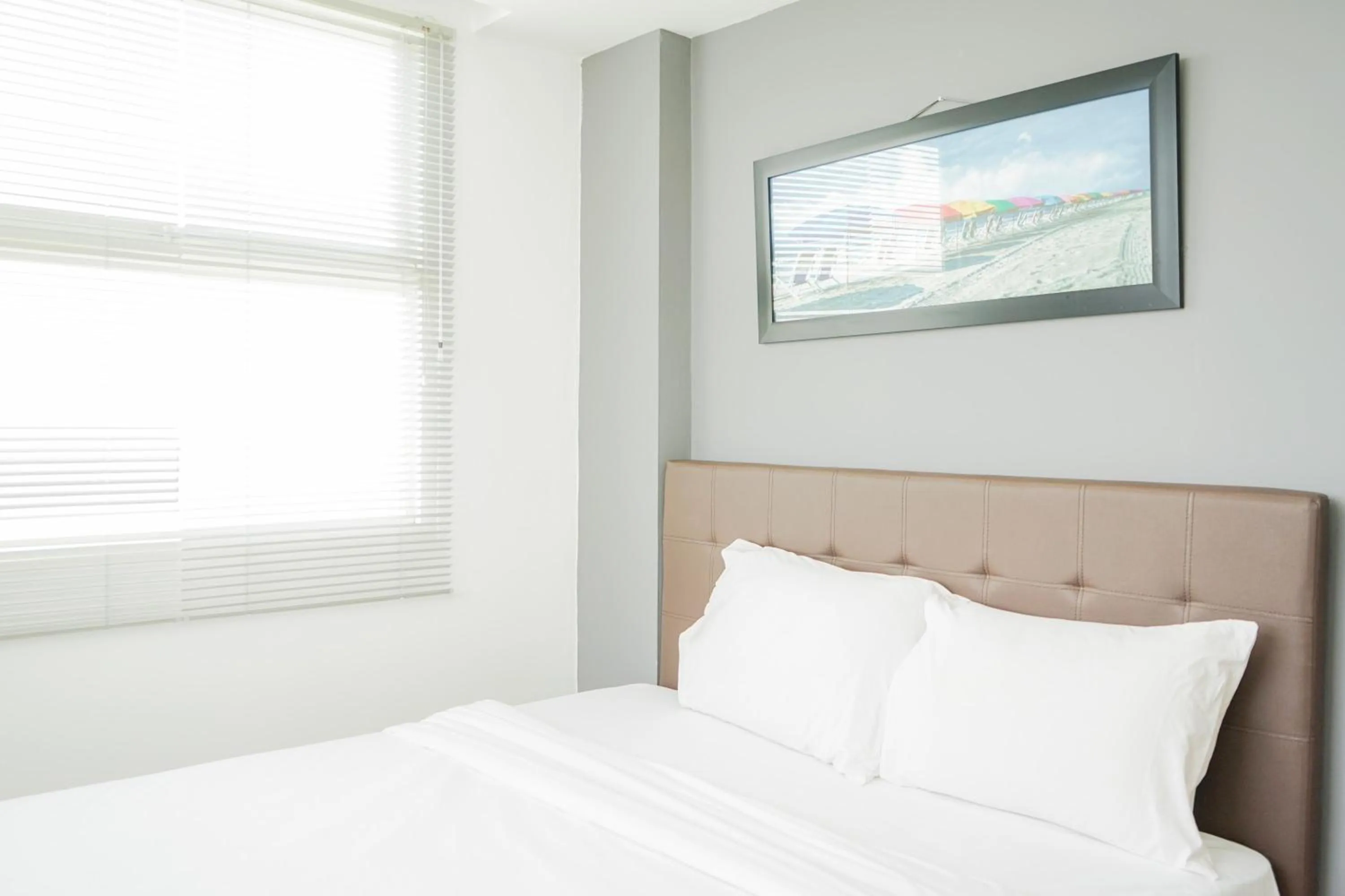 Bed in Cozy 2BR Apartment at Tuscany Residences With Garden View By Travelio