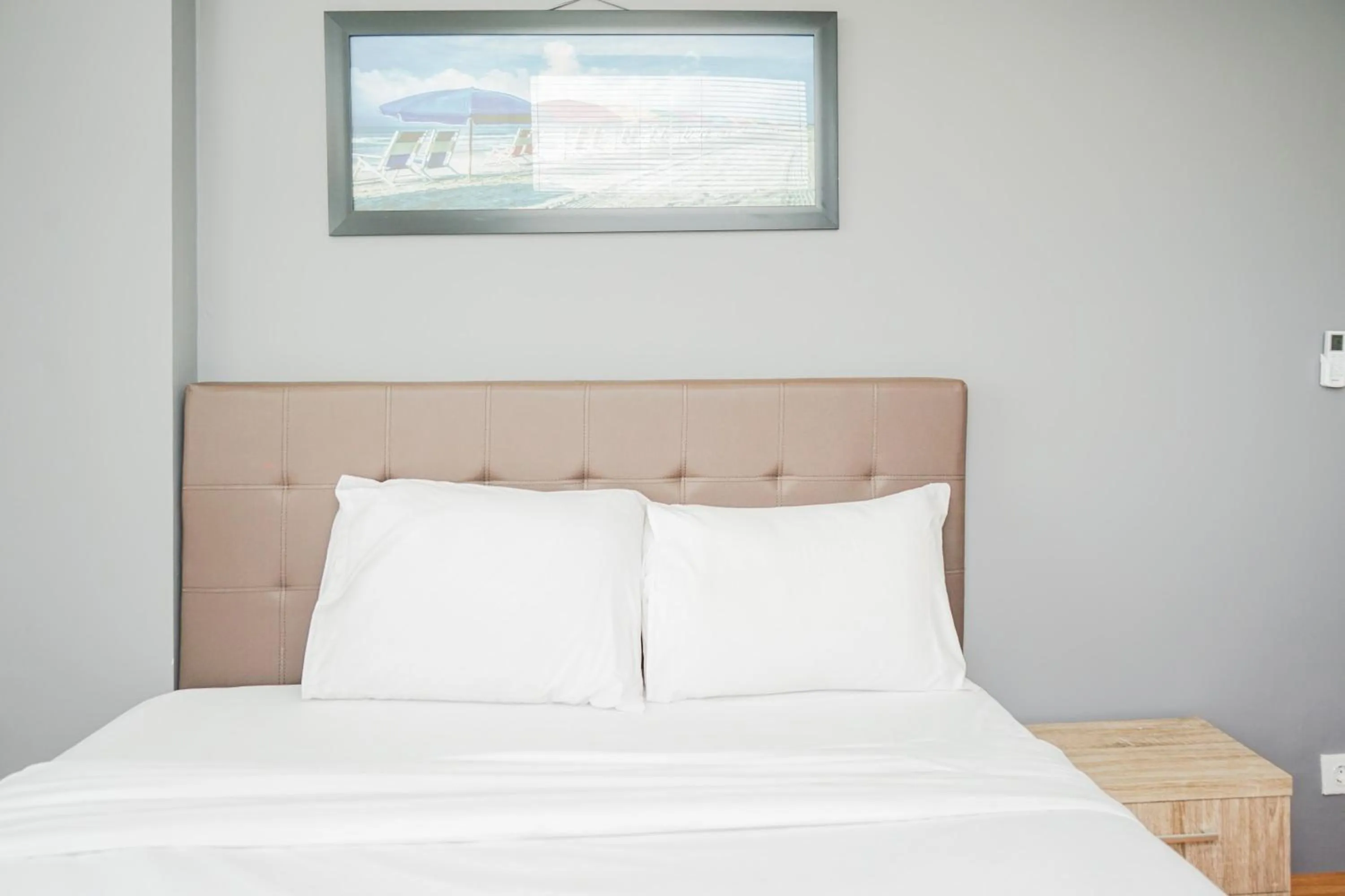 Bed in Cozy 2BR Apartment at Tuscany Residences With Garden View By Travelio