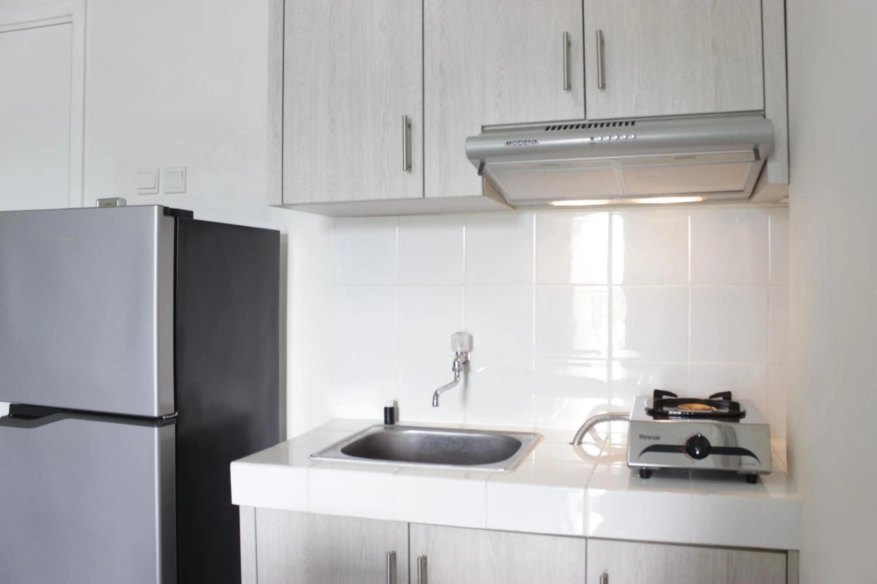 Kitchen or kitchenette in Spacious 3BR Apartment Parahyangan Residence near UNPAR By Travelio