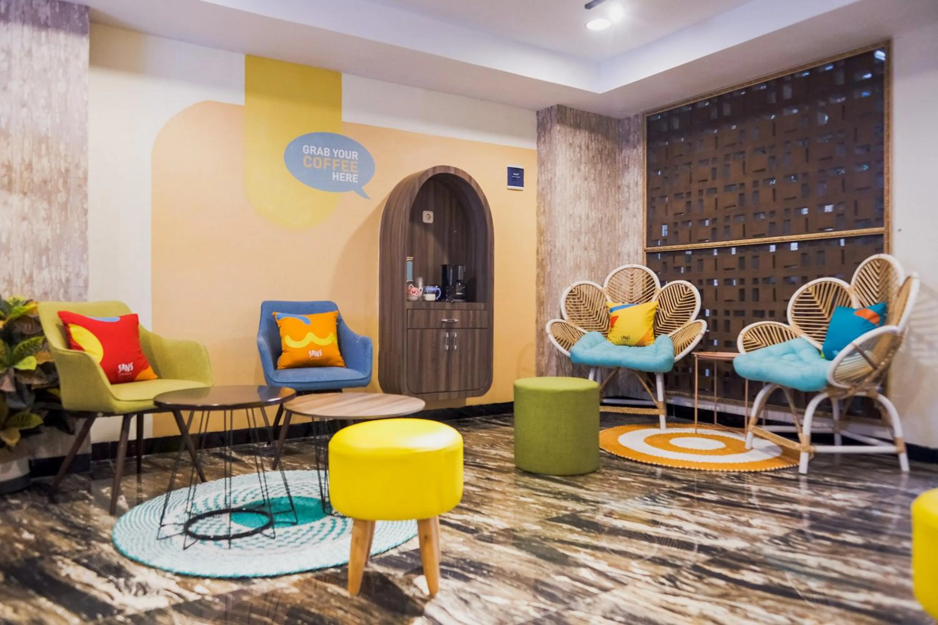 Seating area in Sans Hotel Cemara Asri Medan