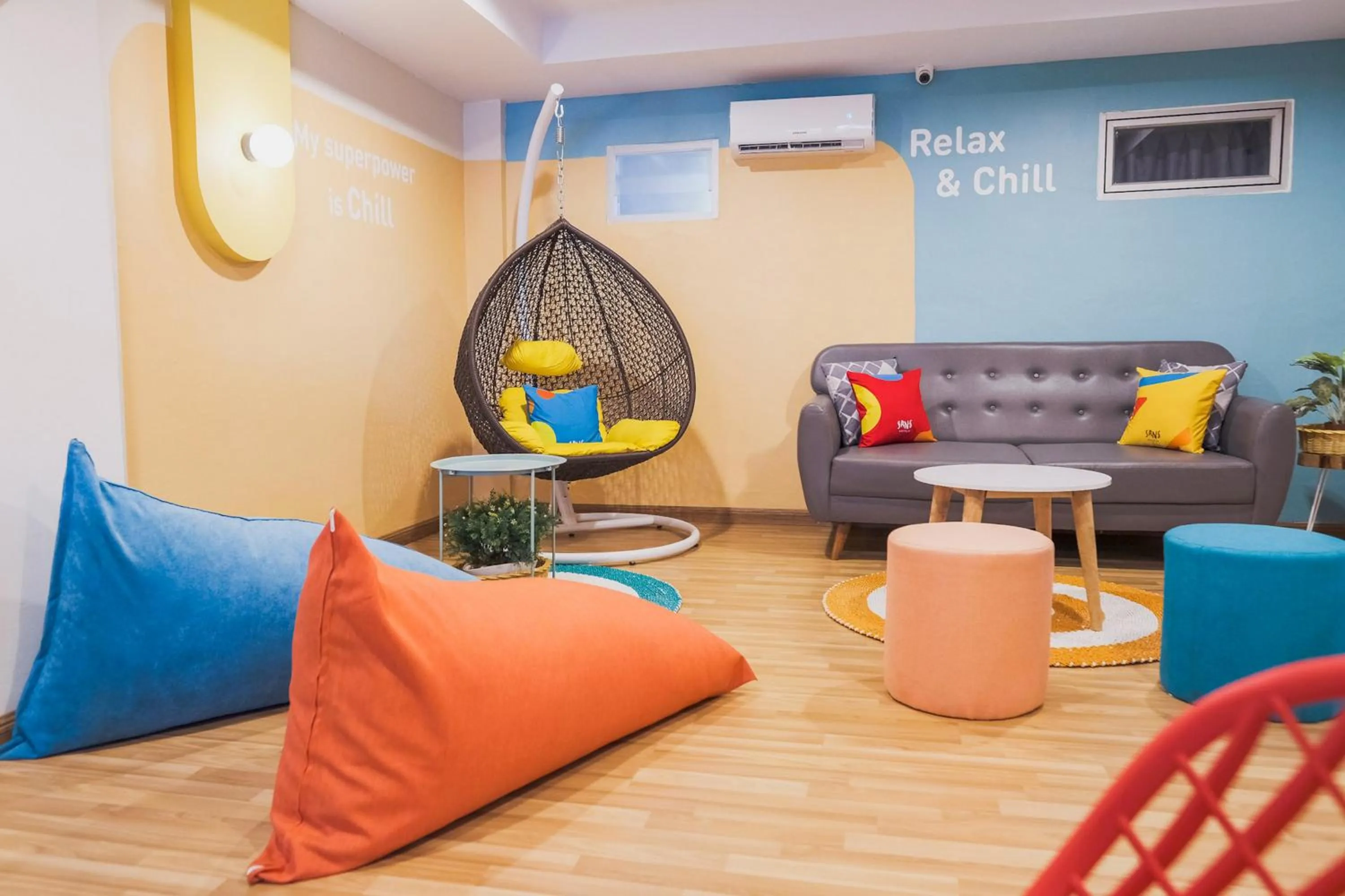 Seating area in Sans Hotel Cemara Asri Medan