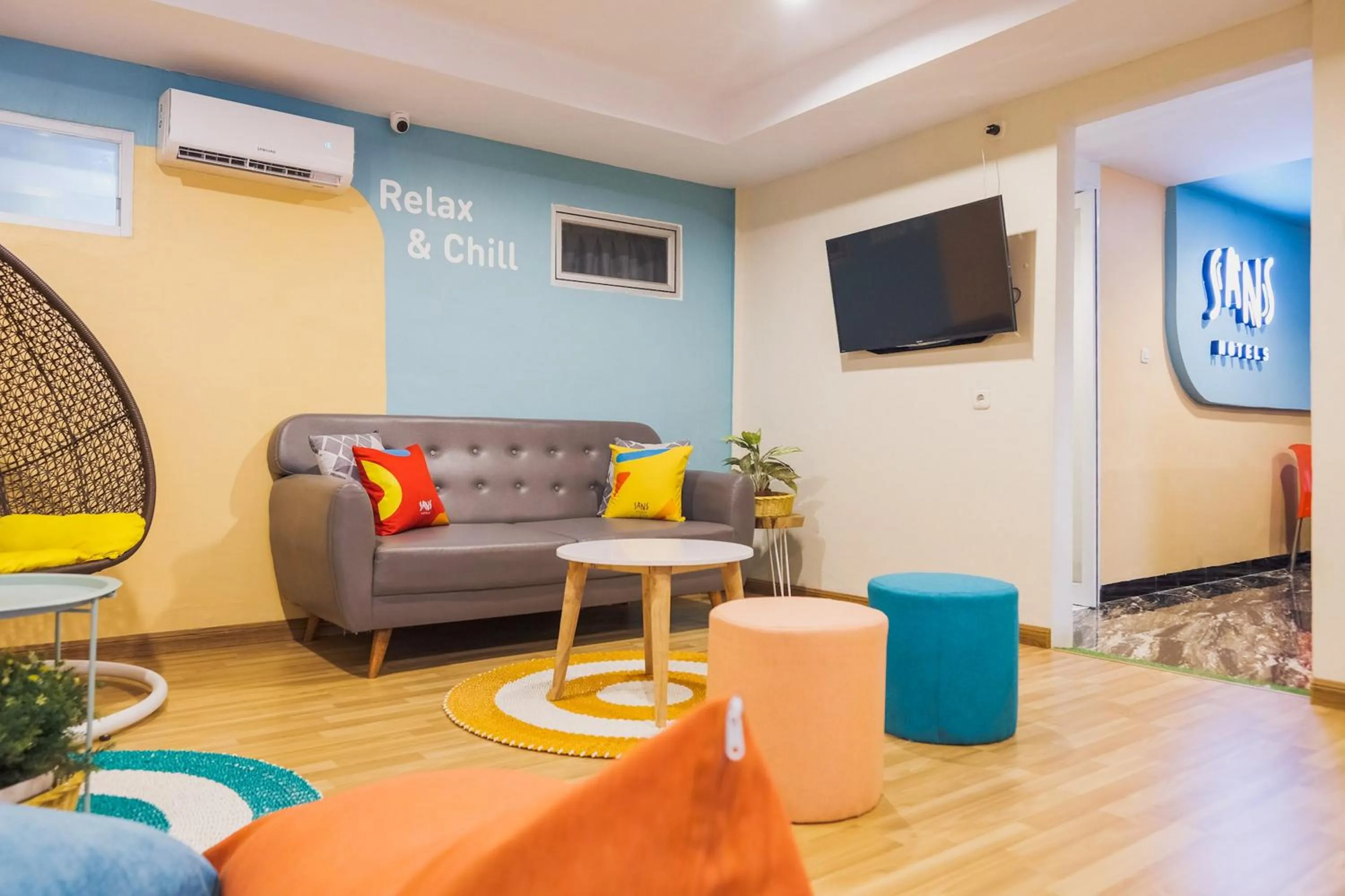 Seating area in Sans Hotel Cemara Asri Medan