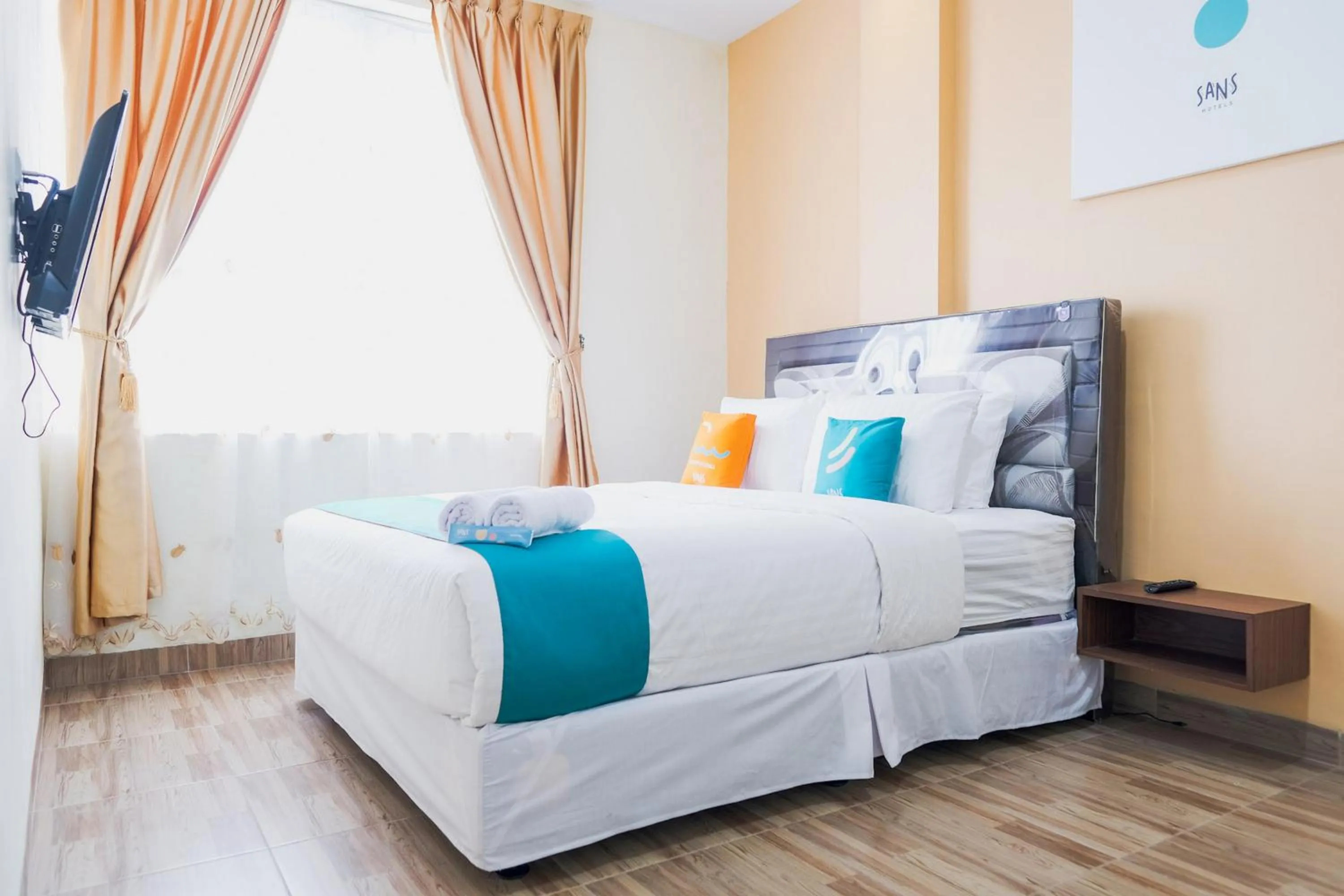 Bedroom, Bed in Sans Hotel Cemara Asri Medan