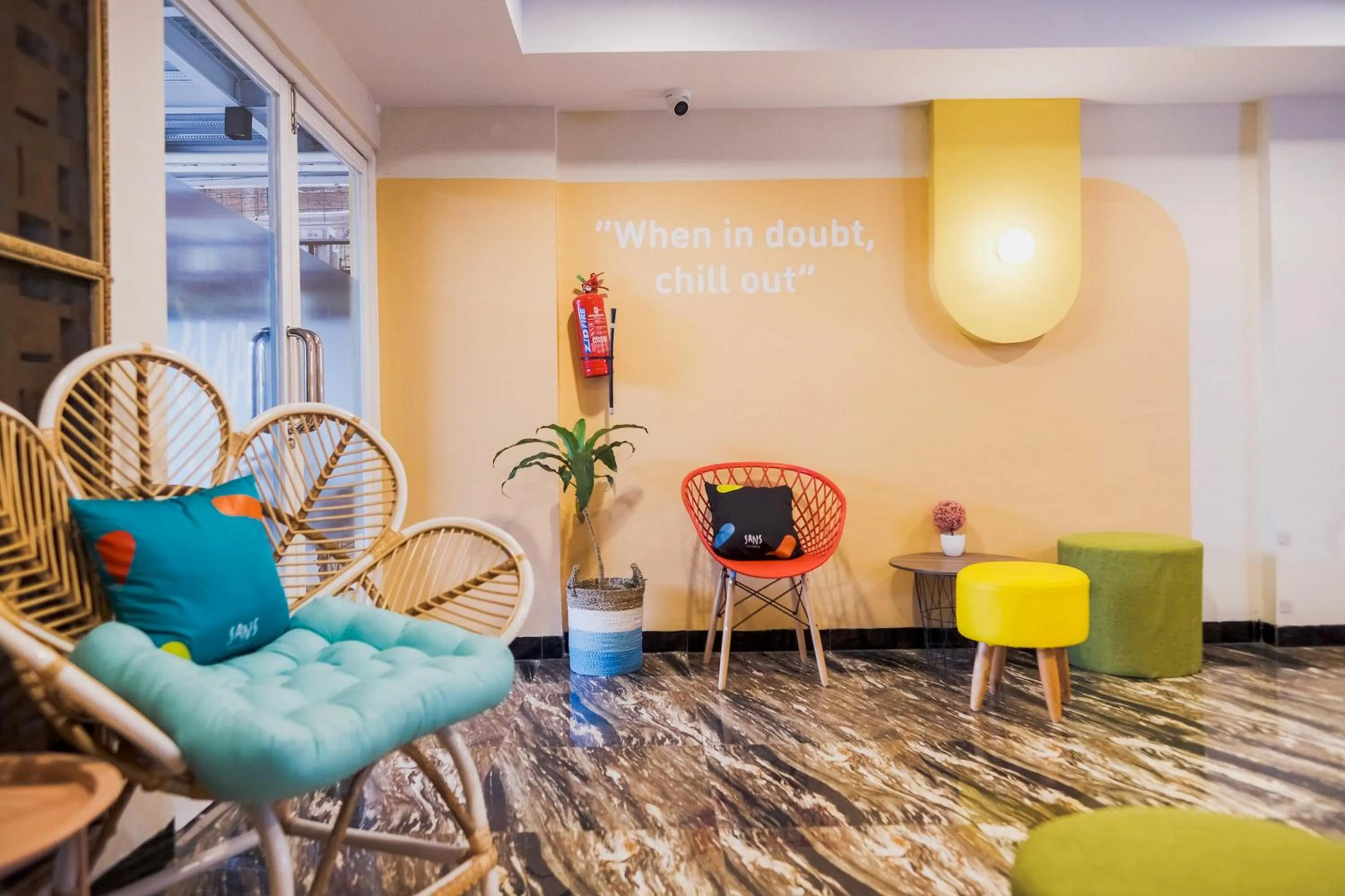 Seating area in Sans Hotel Cemara Asri Medan