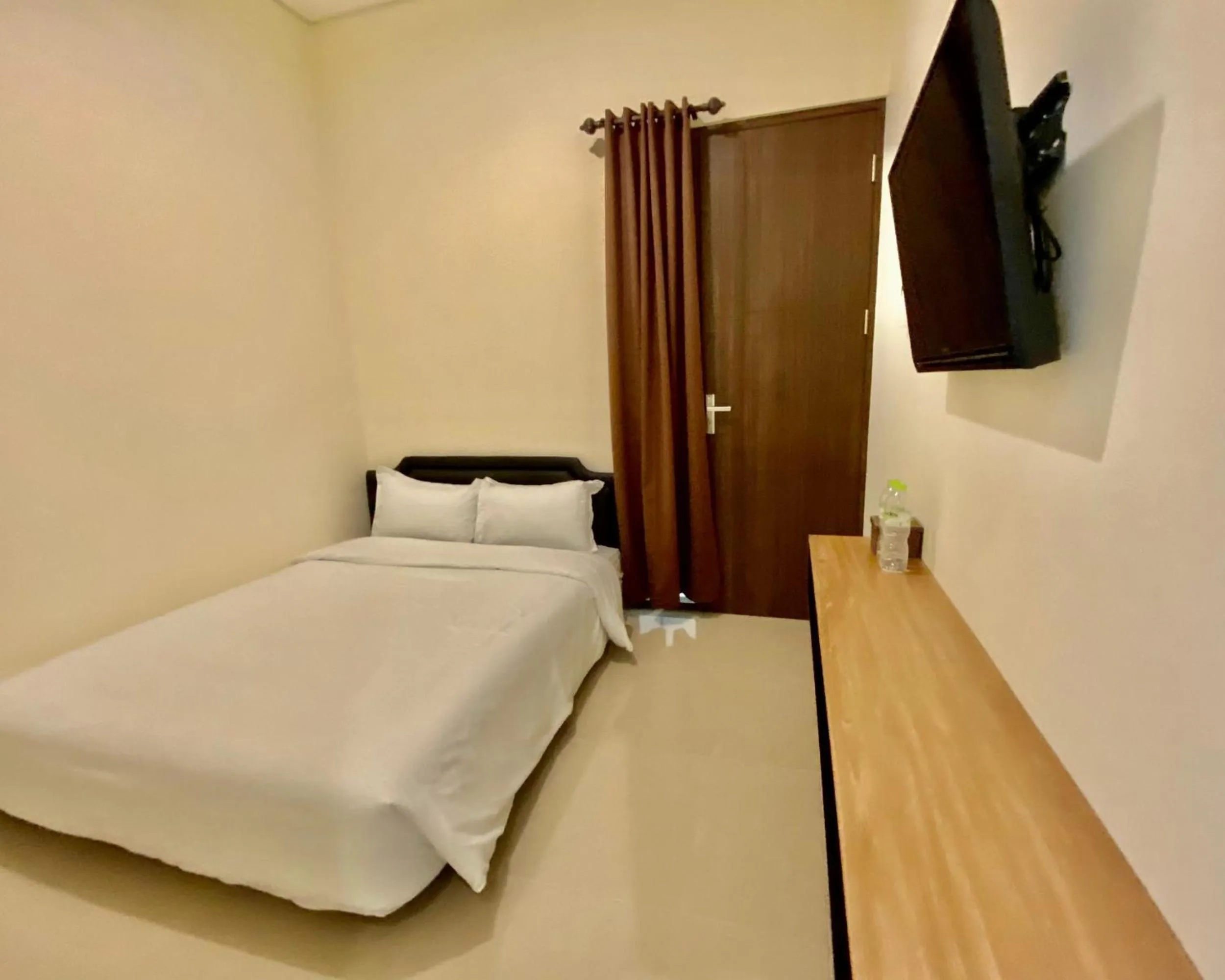 Bed in RedDoorz at Arkana Seturan Pakuwon Mall
