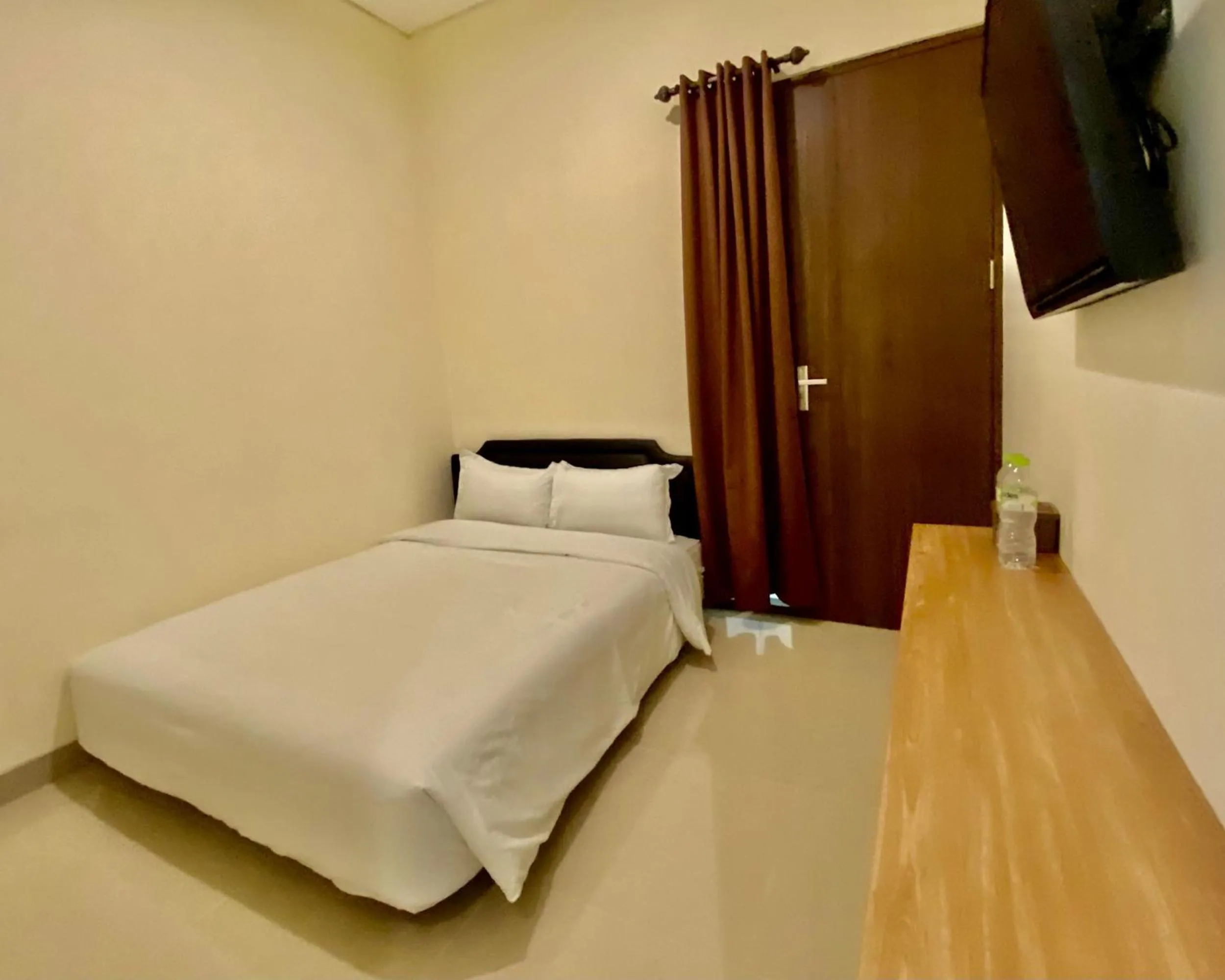 Bed in RedDoorz at Arkana Seturan Pakuwon Mall