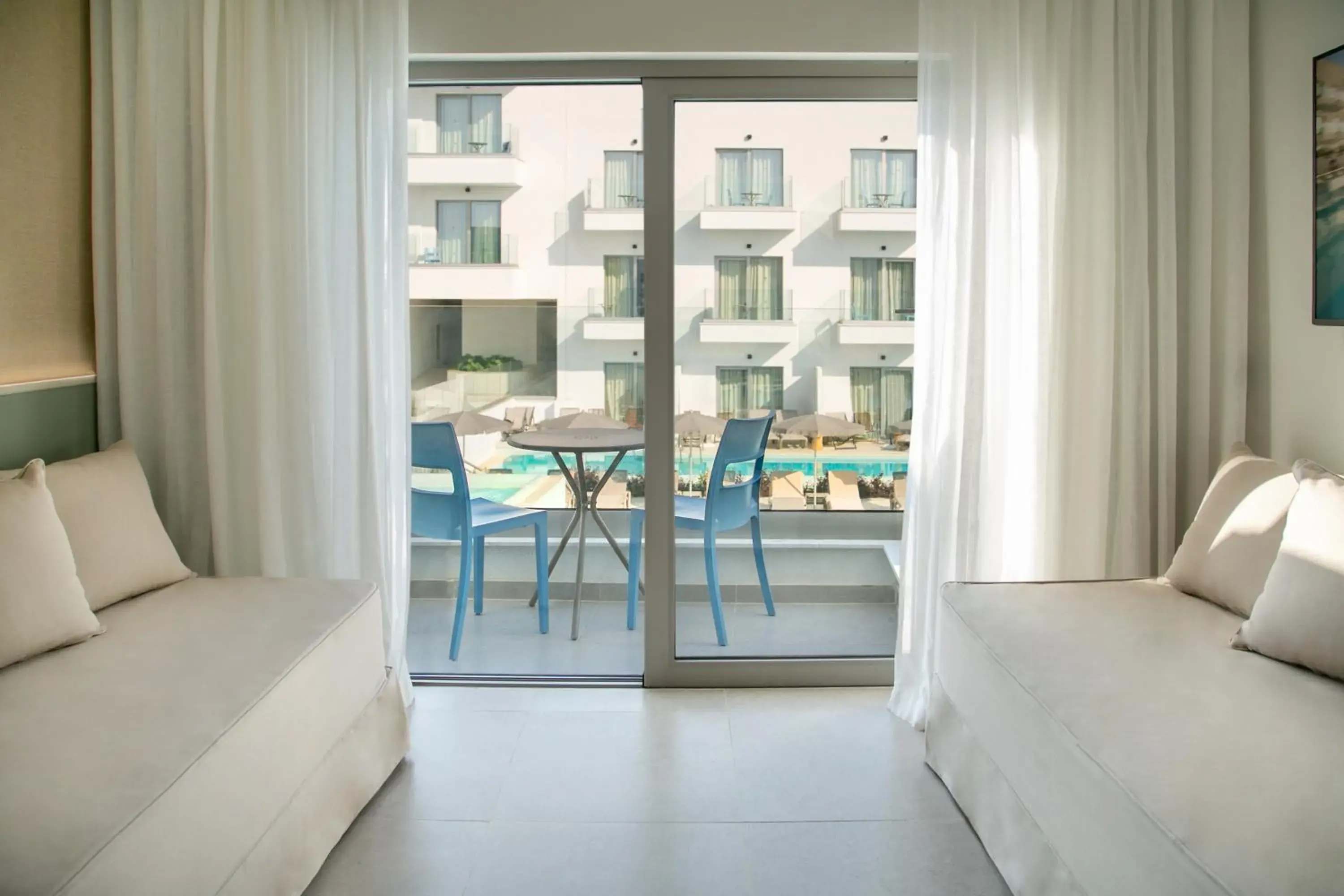 Family Room Pool View with Sliding Door in Atlantica Aqua Blue Family Room Pool View with Sliding Door in Atlantica Aqua Blue