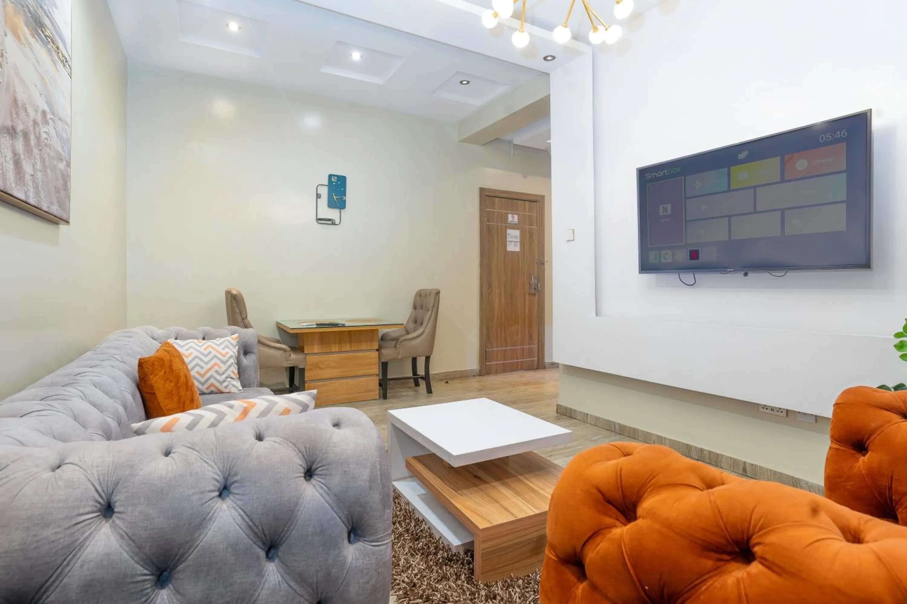 Living room in God's Touch Apartments Signature