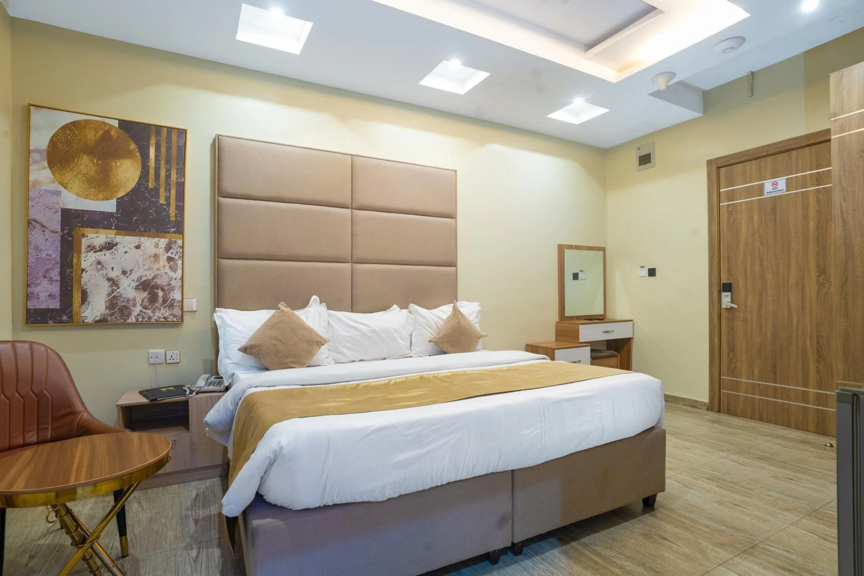 Bed in God's Touch Apartments Signature