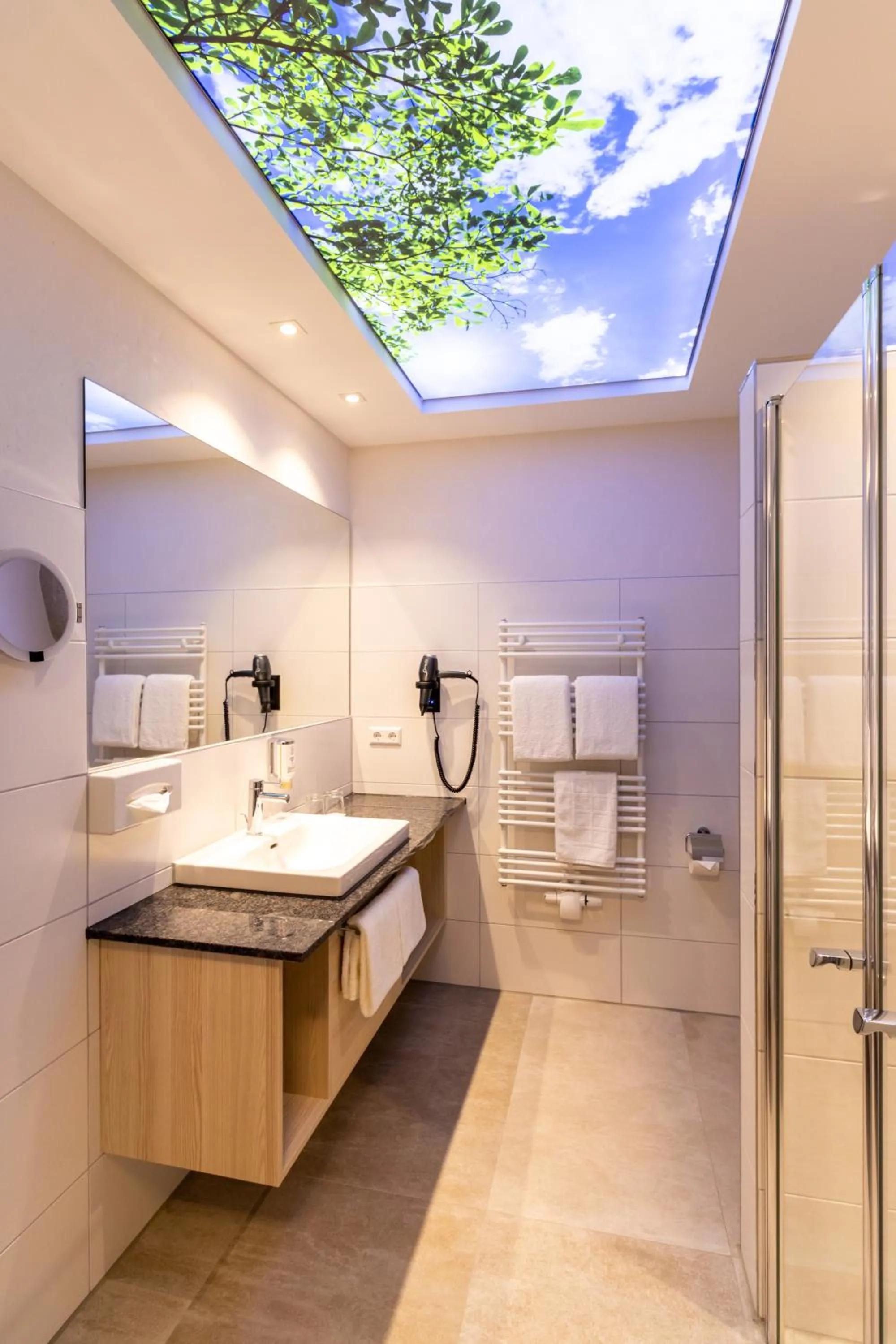 Bathroom in Hotel & Apartments Leugermann