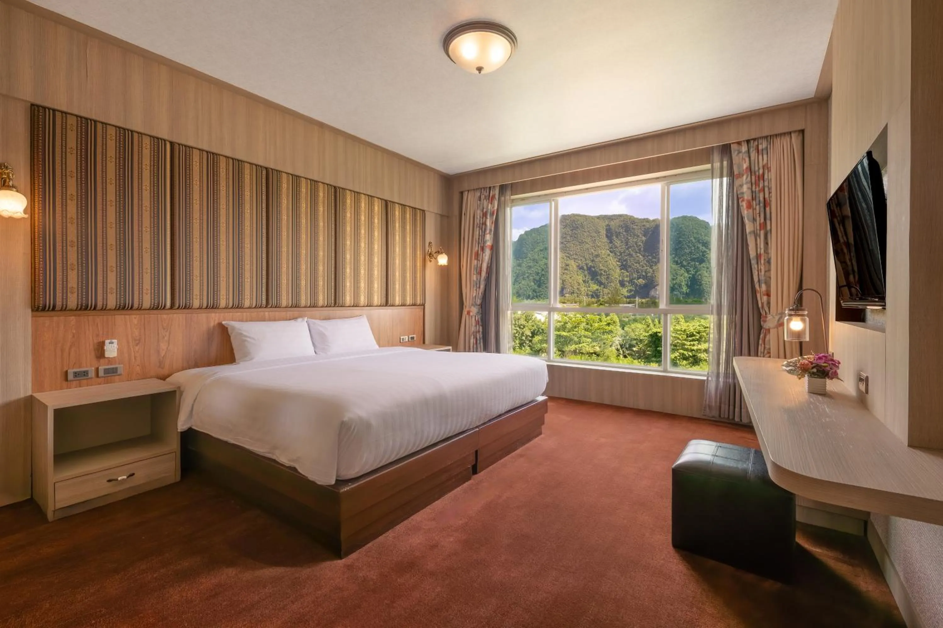 Bed in Le Erawan Phang Nga Hotel