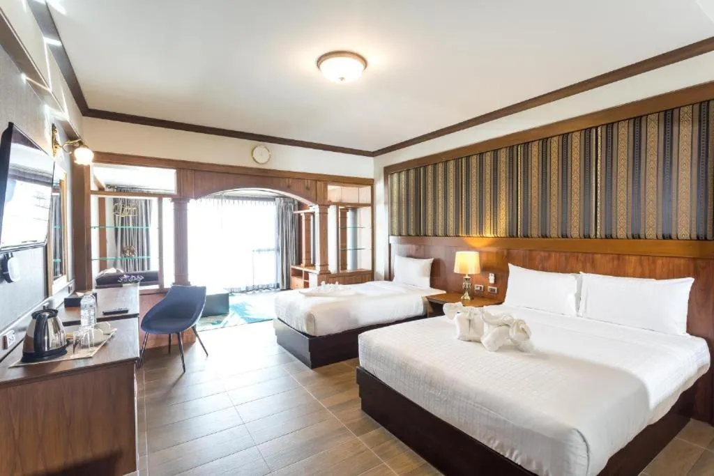 Bed in Le Erawan Phang Nga Hotel