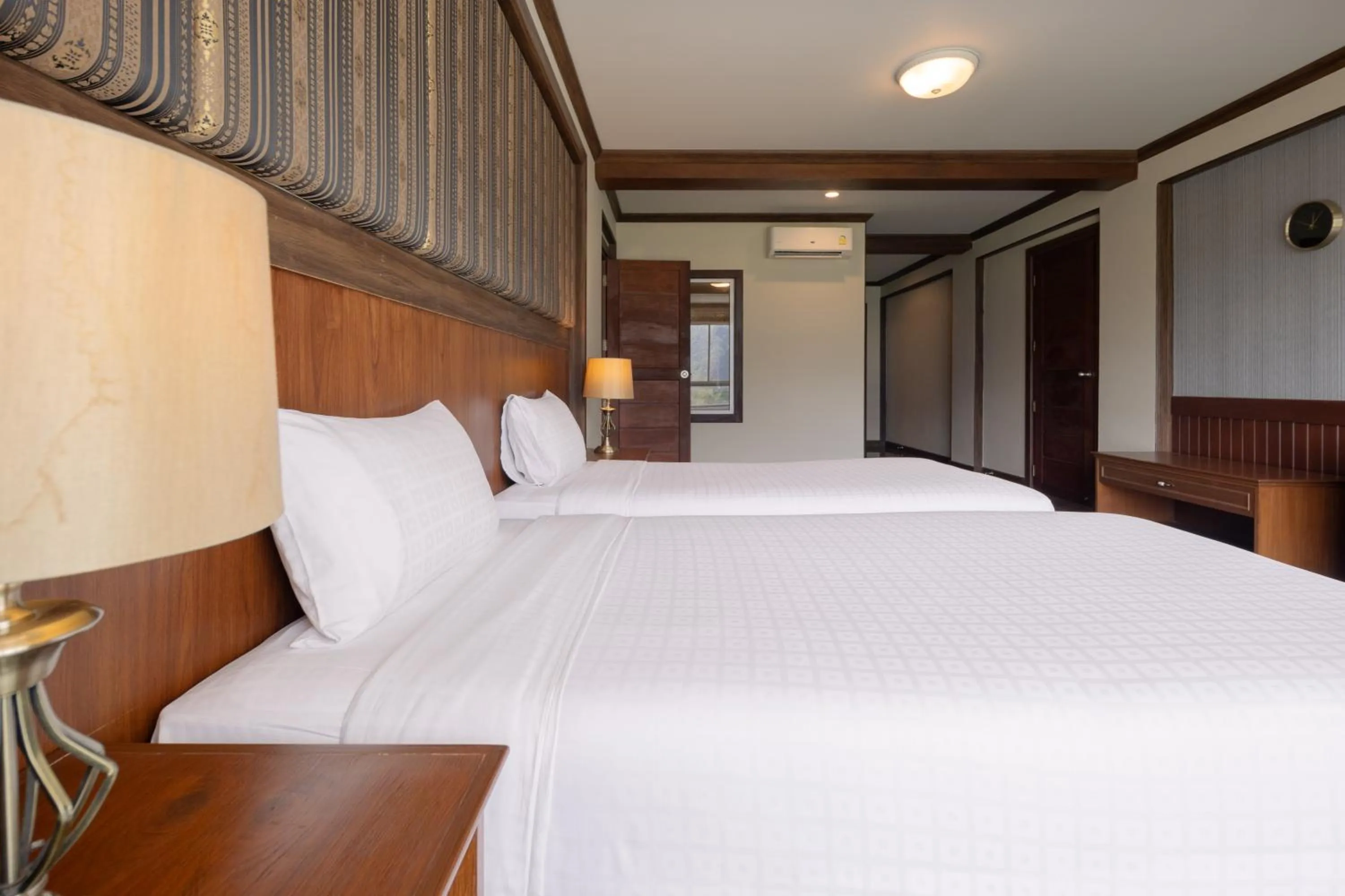 Bed in Le Erawan Phang Nga Hotel