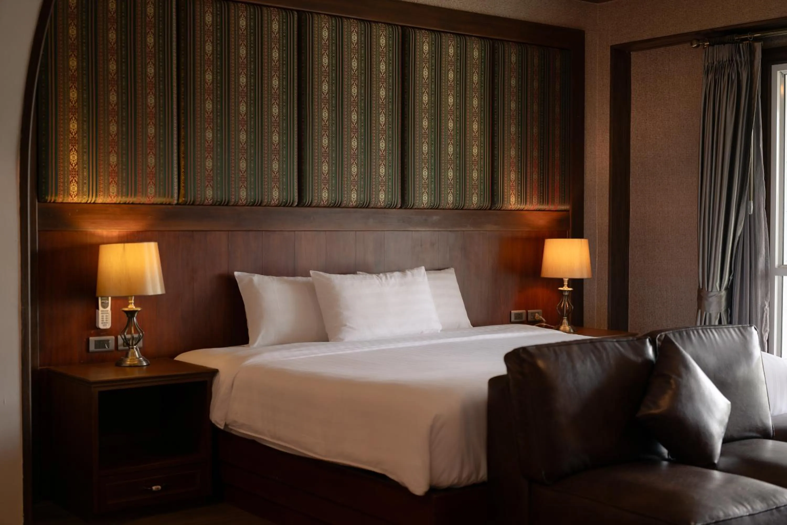 Bed in Le Erawan Phang Nga Hotel