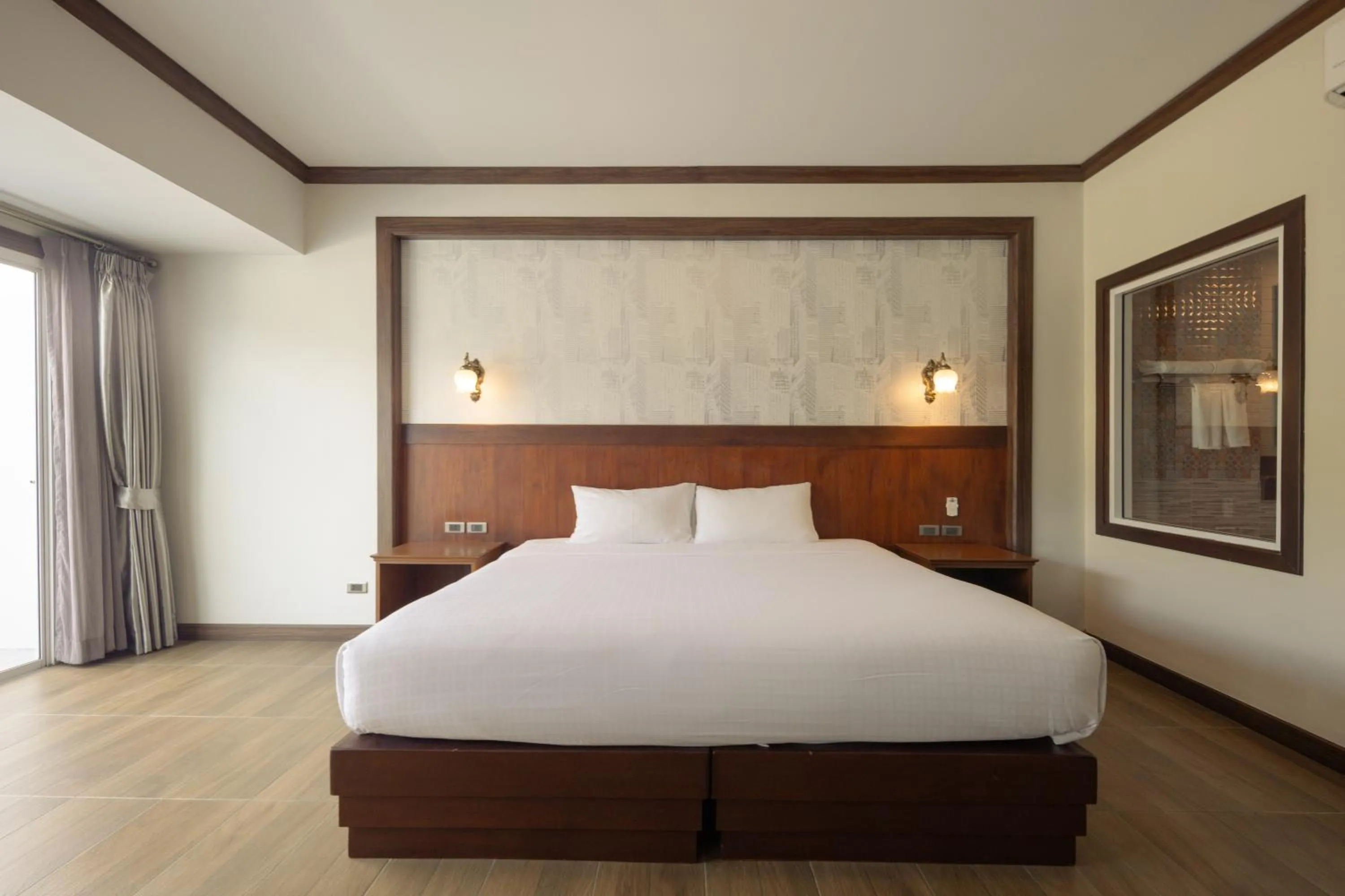 Bed in Le Erawan Phang Nga Hotel