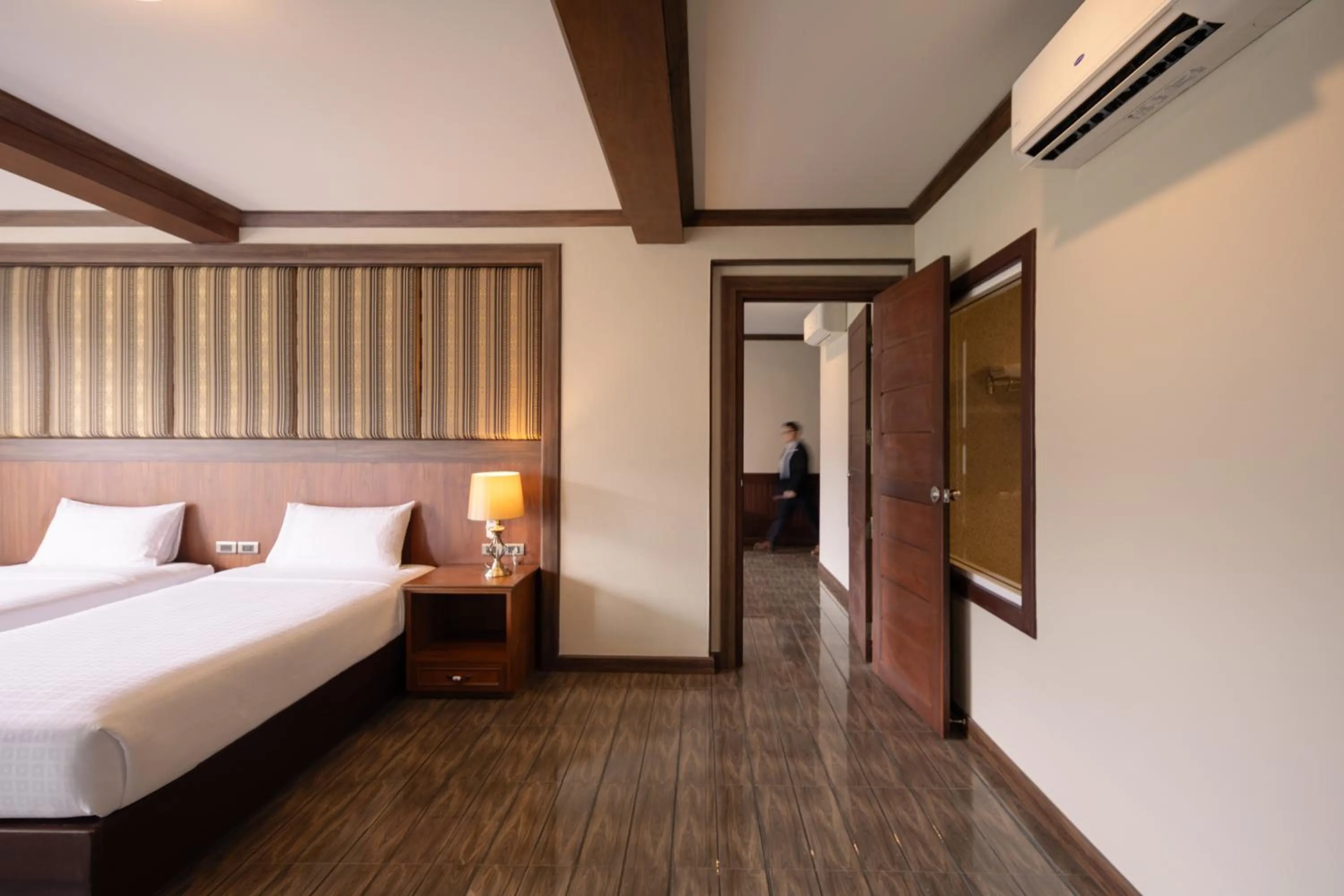 Bed in Le Erawan Phang Nga Hotel