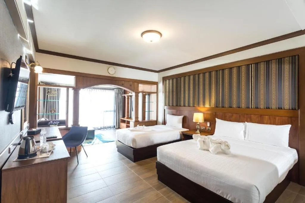 Bed in Le Erawan Phang Nga Hotel