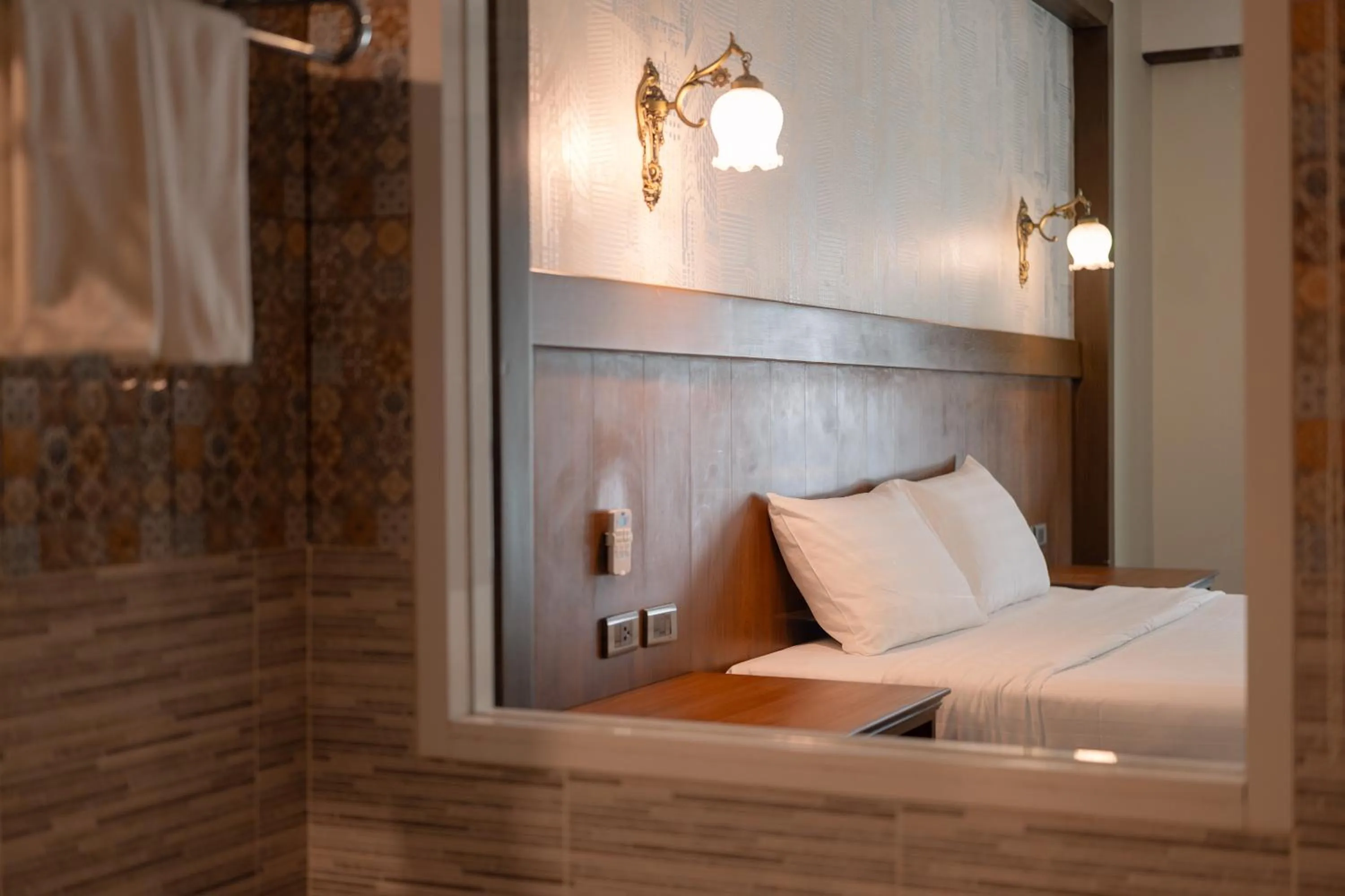 Bed in Le Erawan Phang Nga Hotel