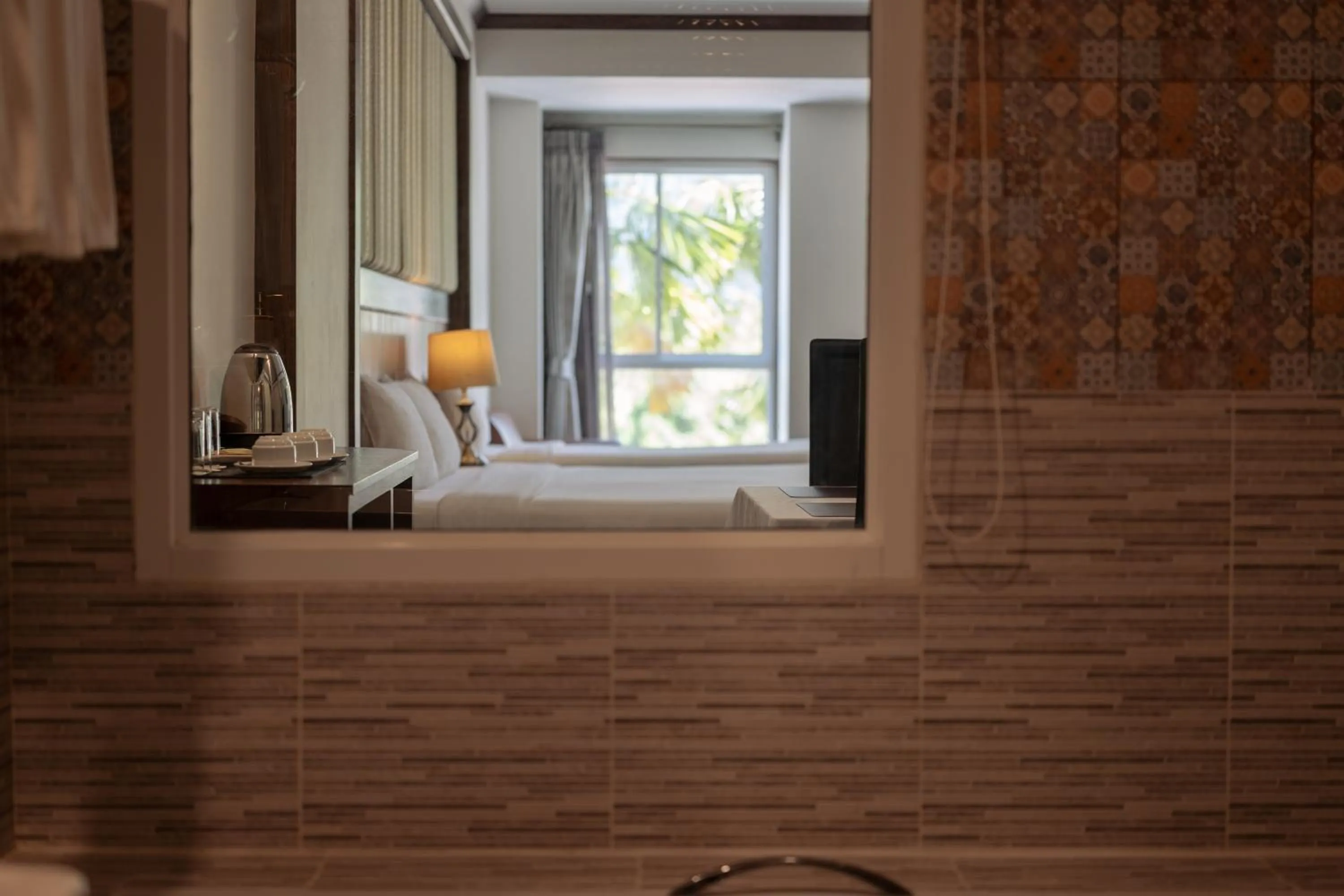 Bed in Le Erawan Phang Nga Hotel