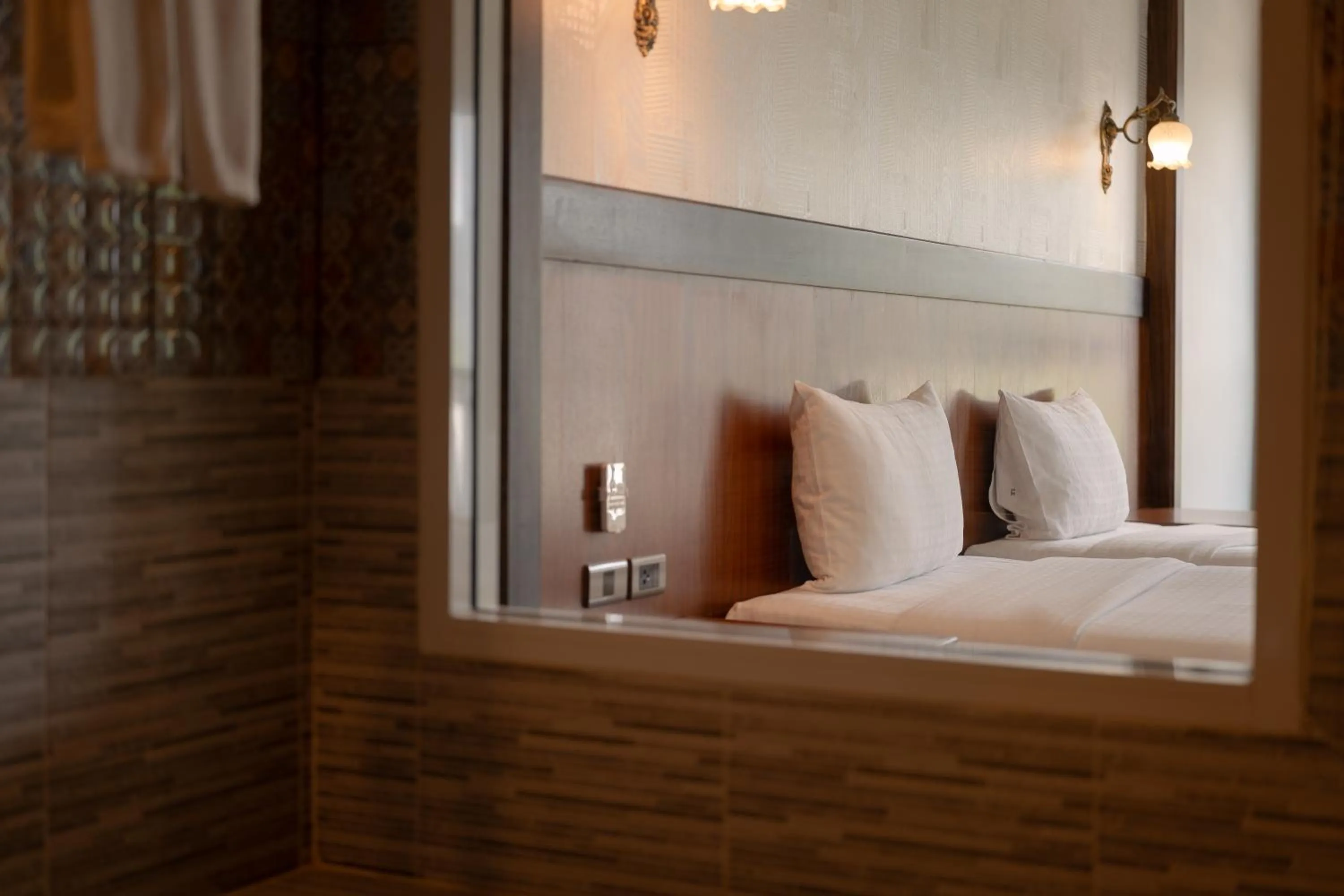 Bed in Le Erawan Phang Nga Hotel