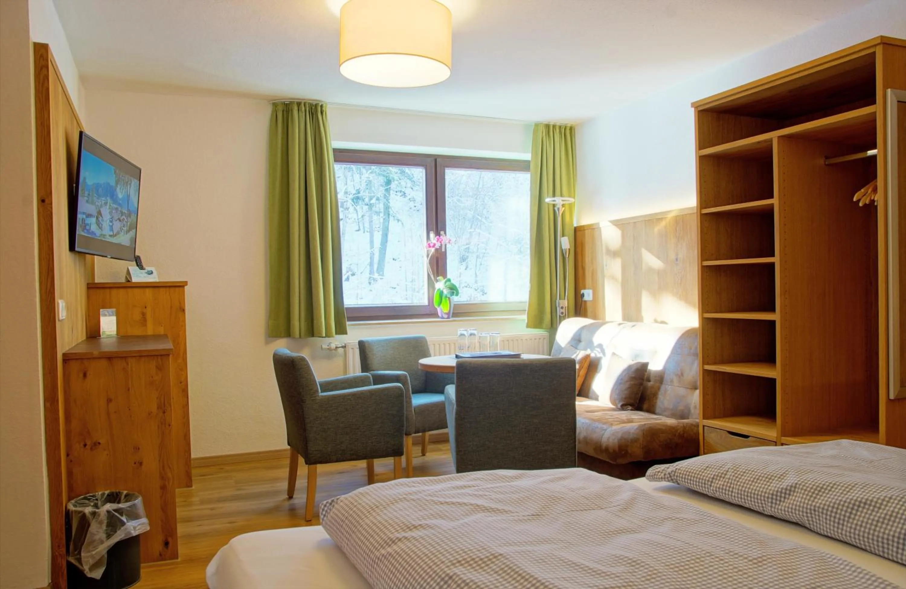 Seating area, Bed in Hotel Waldmann