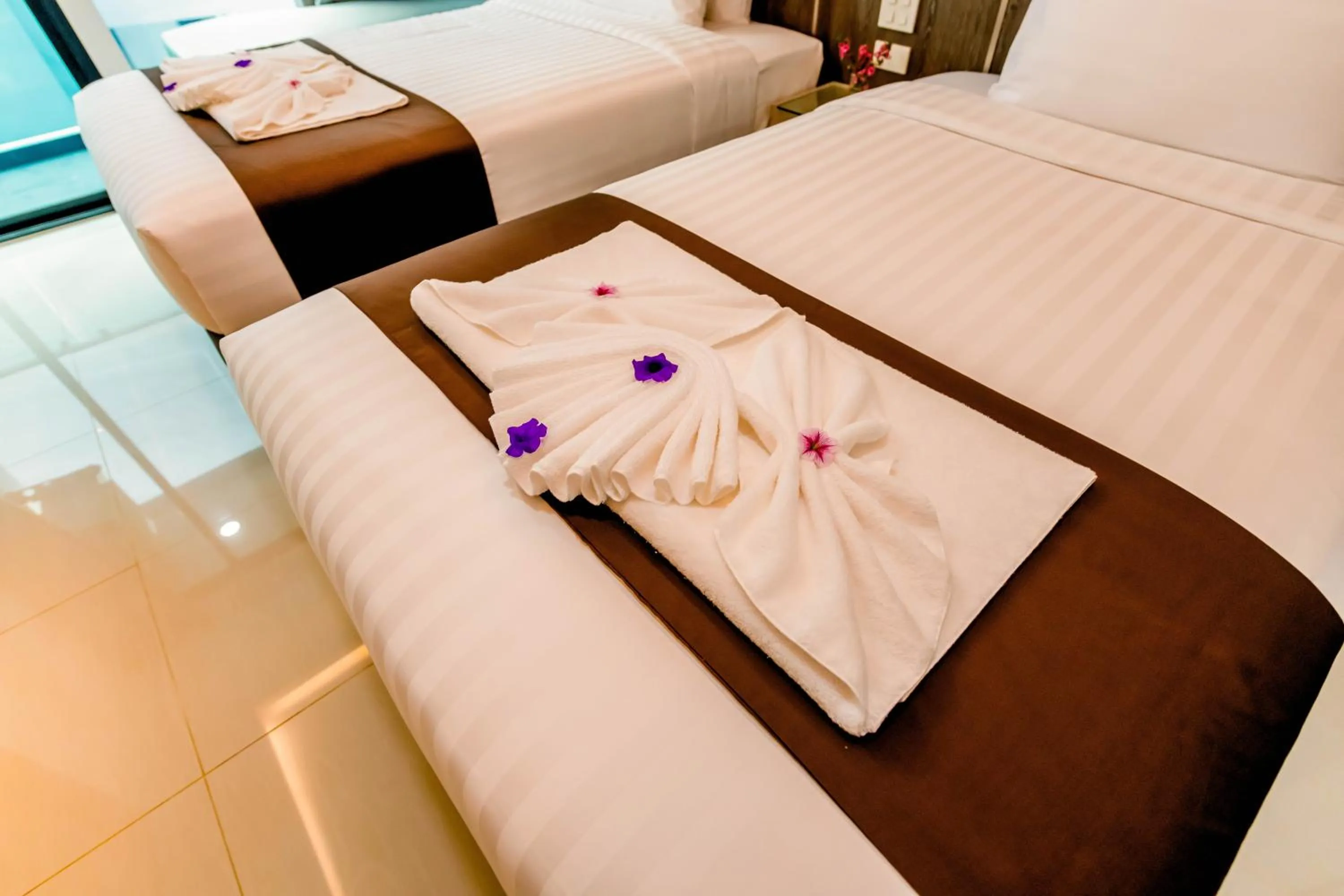 Bed in The Proud Hotel Pattaya - SHA Certified