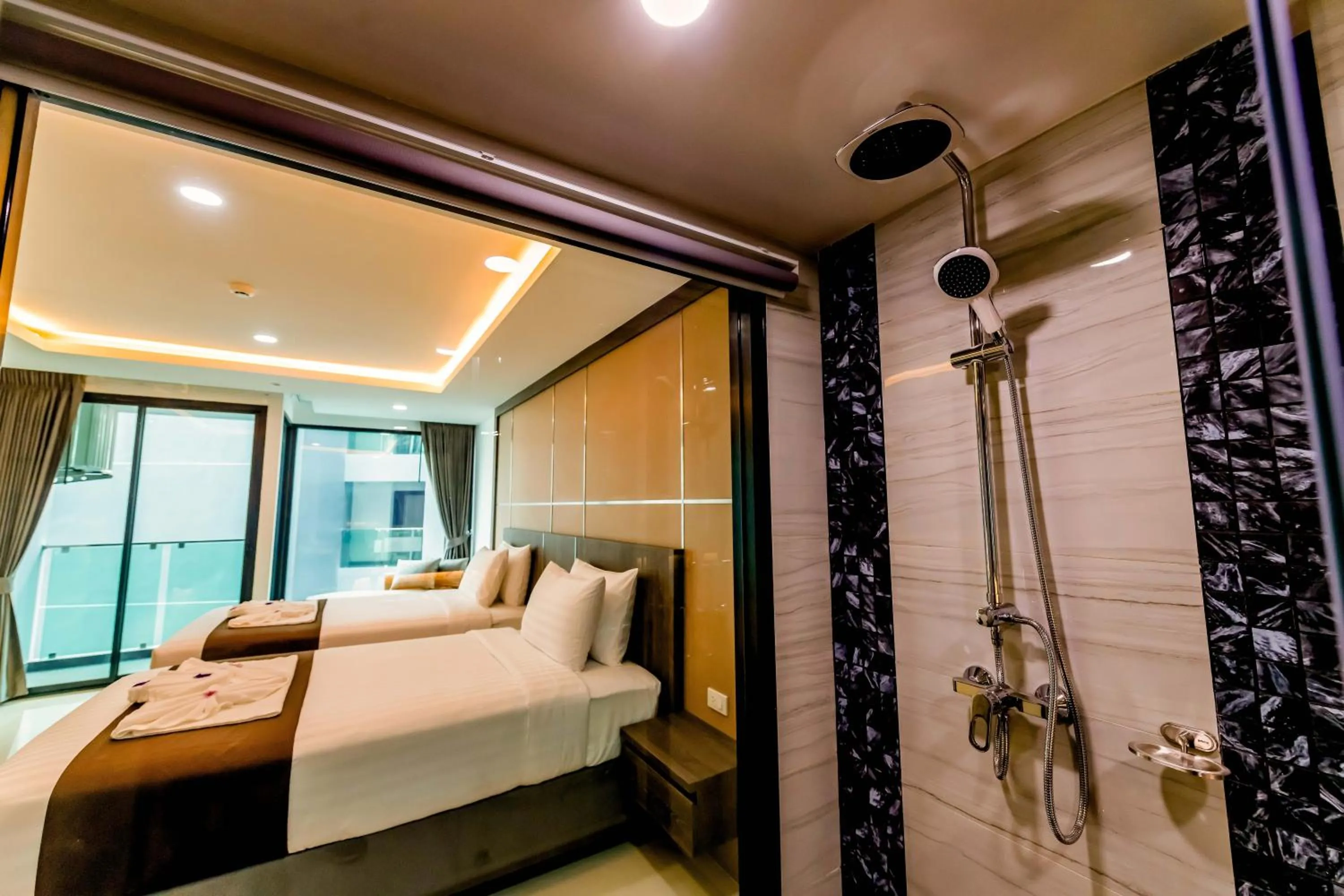 Bed in The Proud Hotel Pattaya - SHA Certified