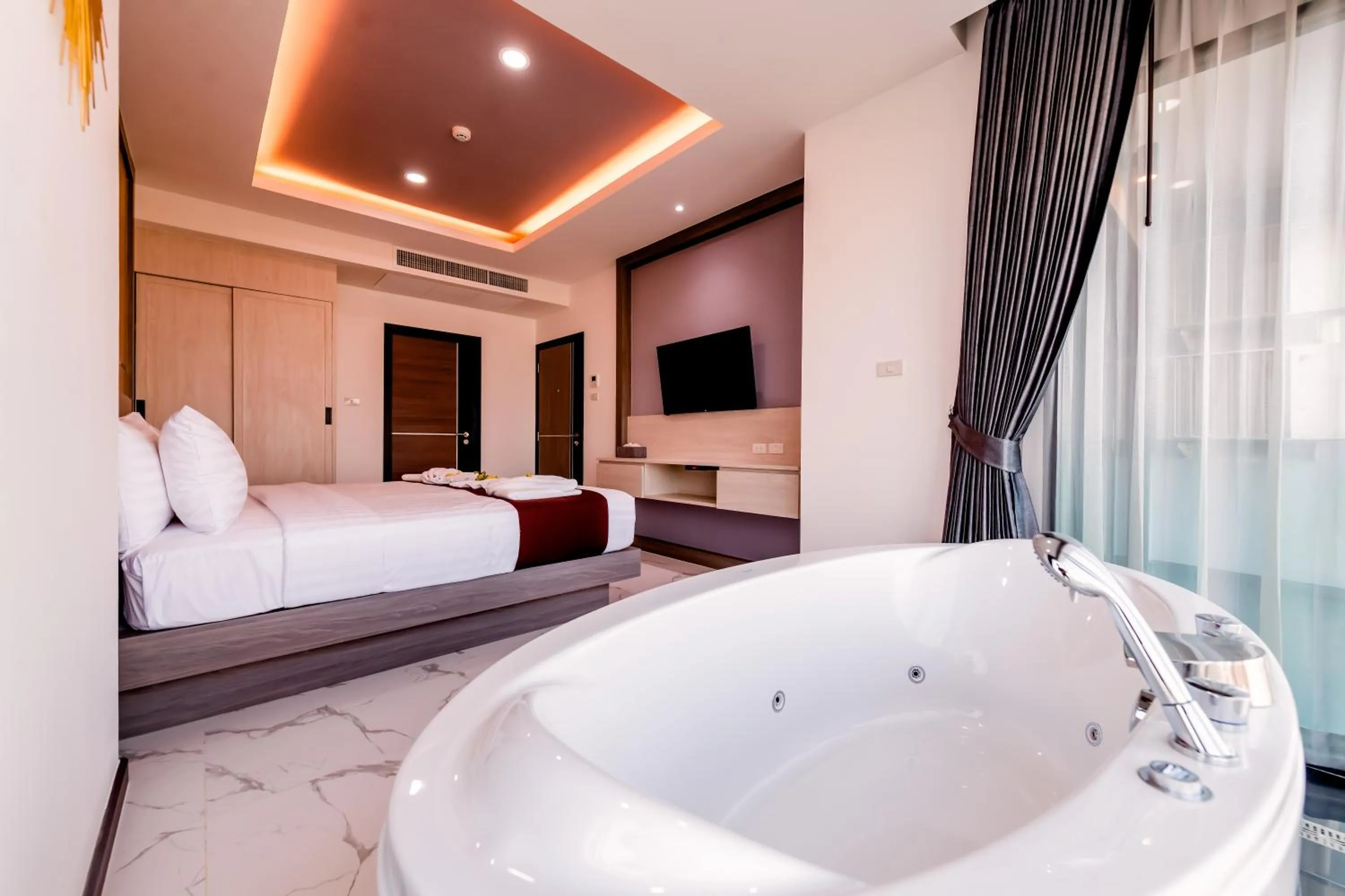 Bed in The Proud Hotel Pattaya - SHA Certified