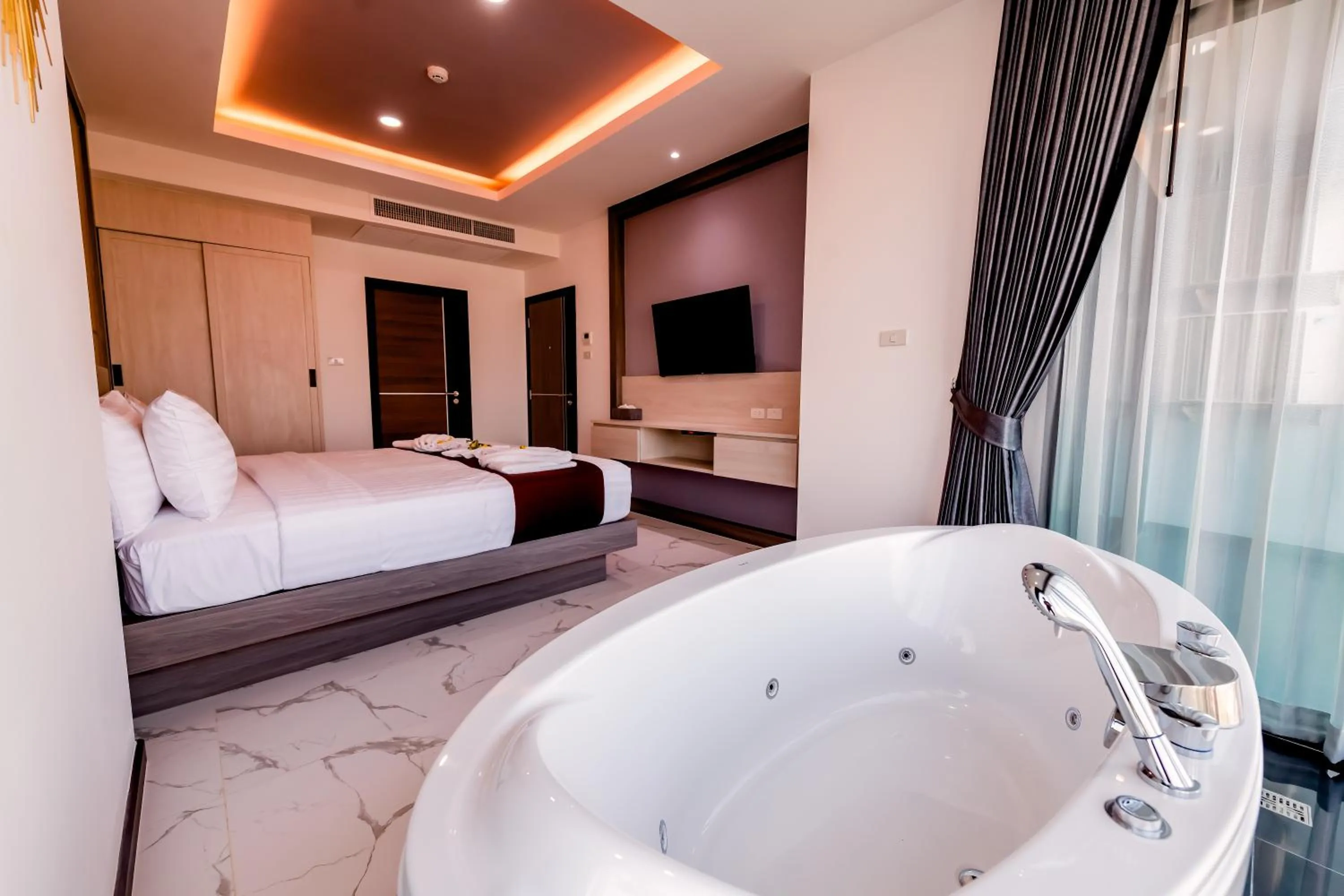 Bed in The Proud Hotel Pattaya - SHA Certified