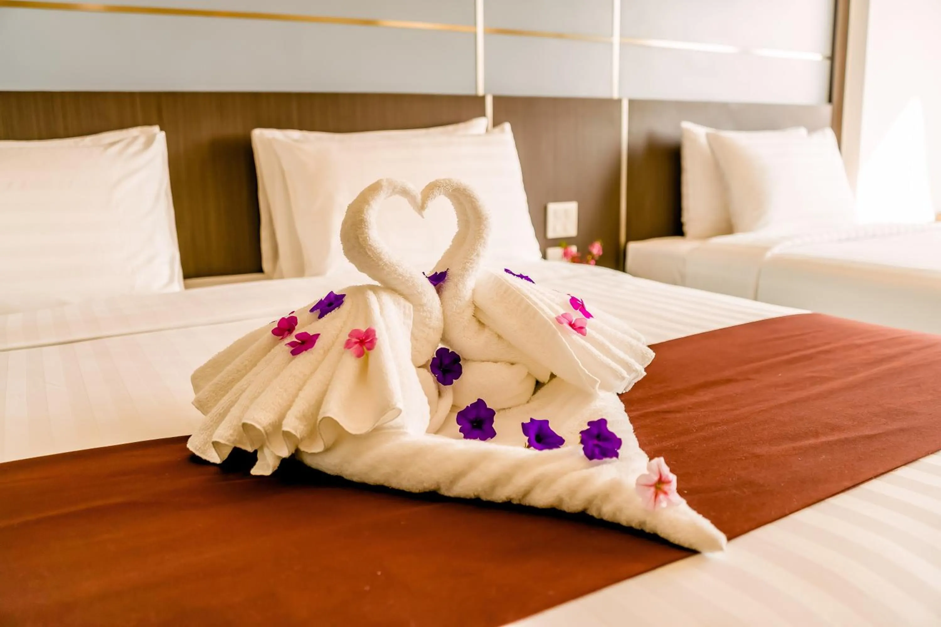 Bed in The Proud Hotel Pattaya - SHA Certified