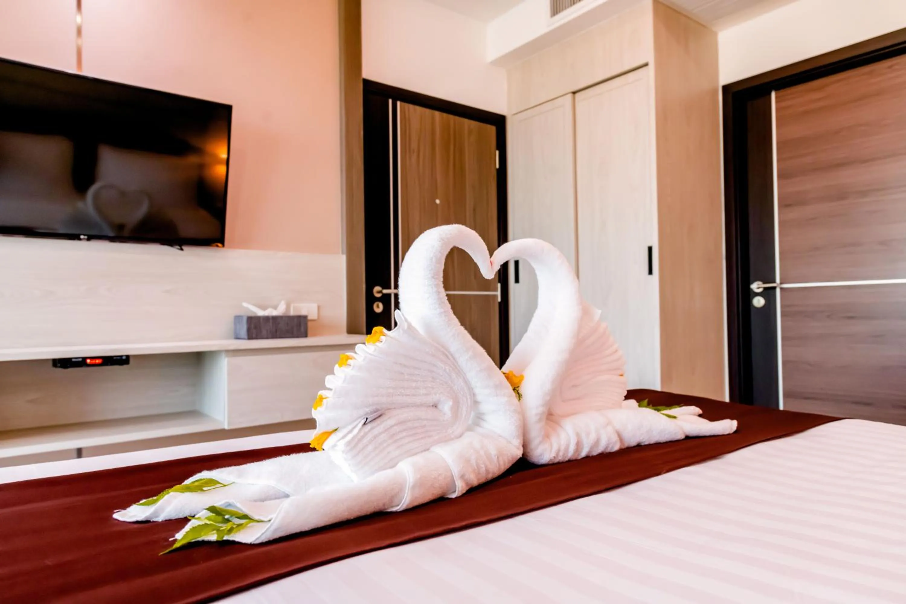 Bed in The Proud Hotel Pattaya - SHA Certified