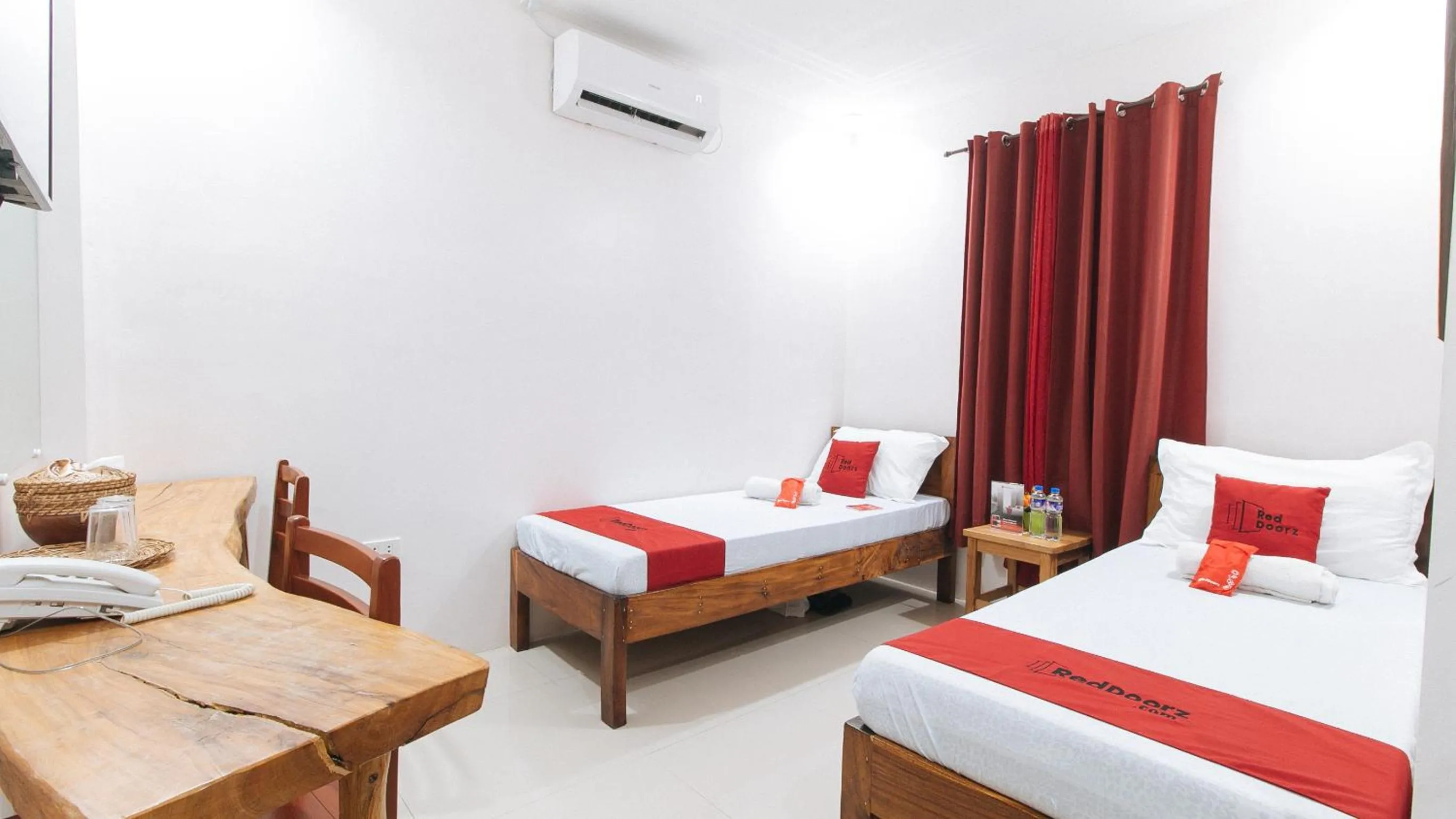 Photo of the whole room, Bed in RedDoorz Plus @ Jollydays Hotel Nueva Ecija