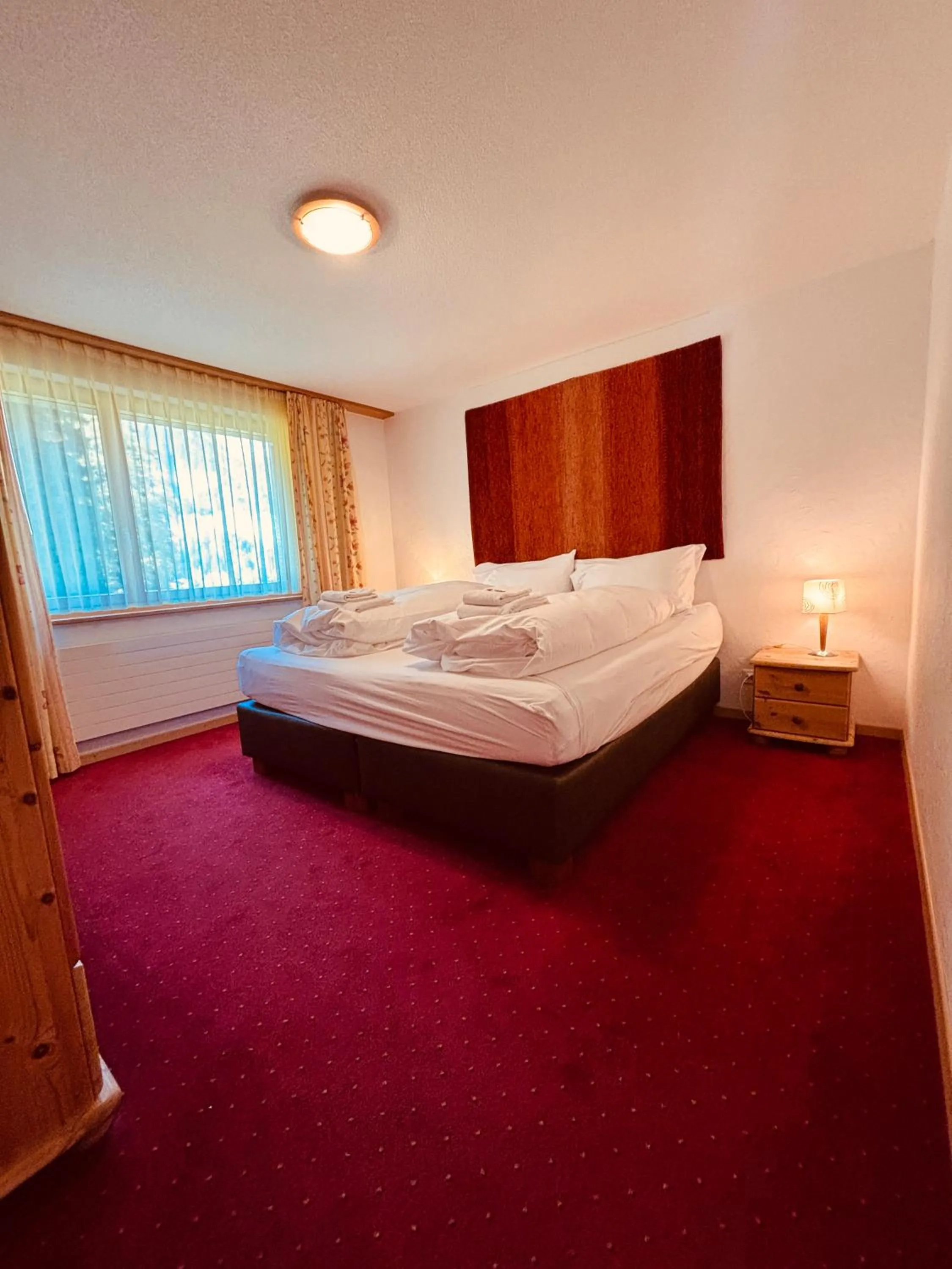 Bed in Typically Swiss Hotel Ermitage