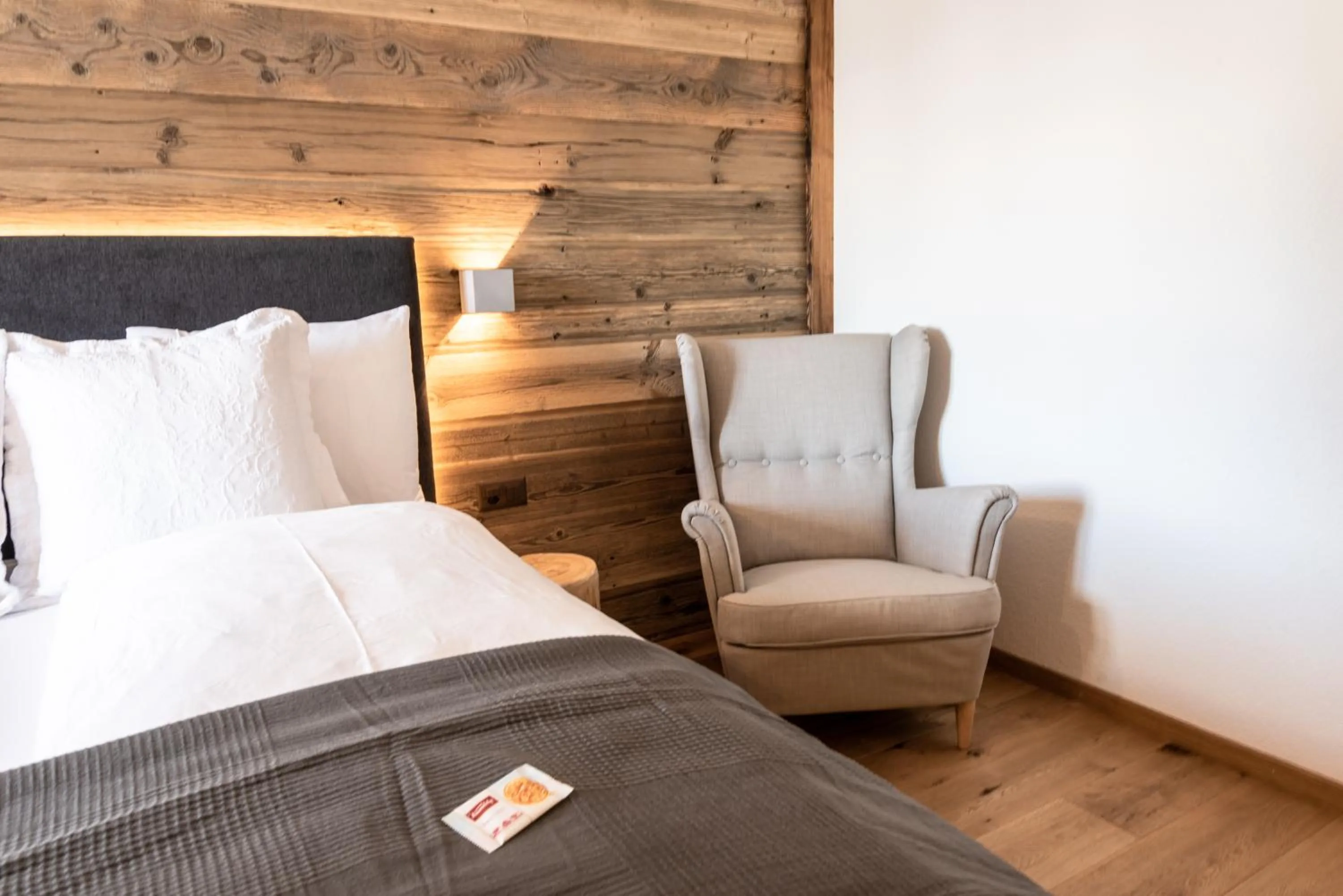 Seating area, Bed in Typically Swiss Hotel Ermitage