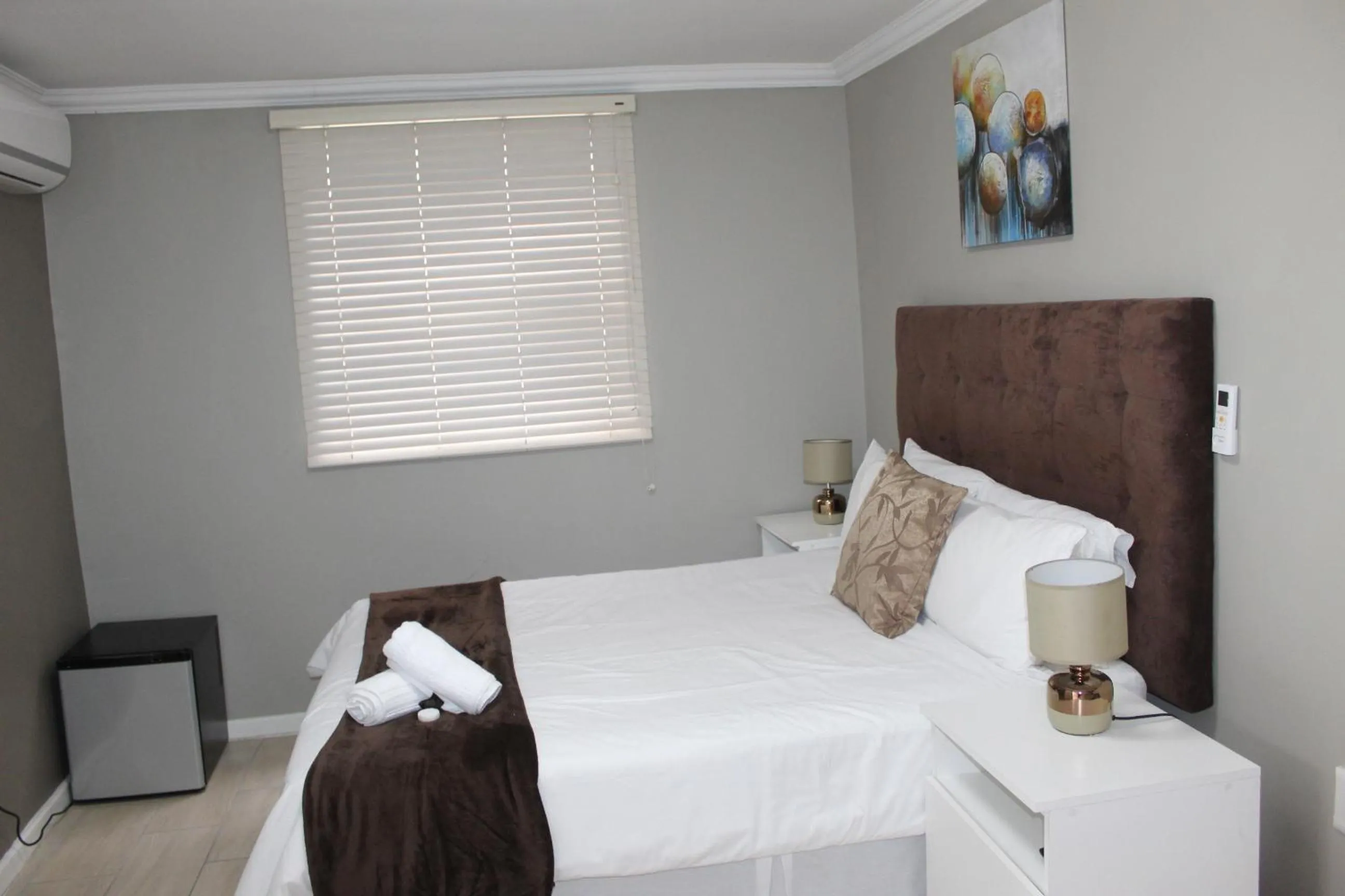 Bed in 103onWallace Self Catering Guest House